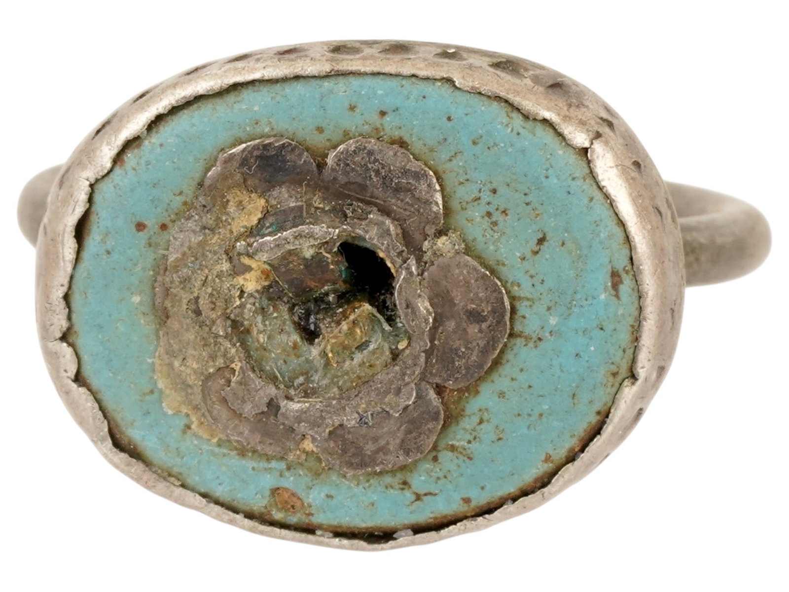 EX RARE ANCIENT ISLAMIC SILVER SIGNET RING 600-700 AD: An extremely rare ancient Egyptian Islamic silver signet ring. Ca. 600 to 700 AD. The crown is set with blue opaque glass and a silver lotus flower of eye-shaped overlay intaglio. Total Weight: 7 gram