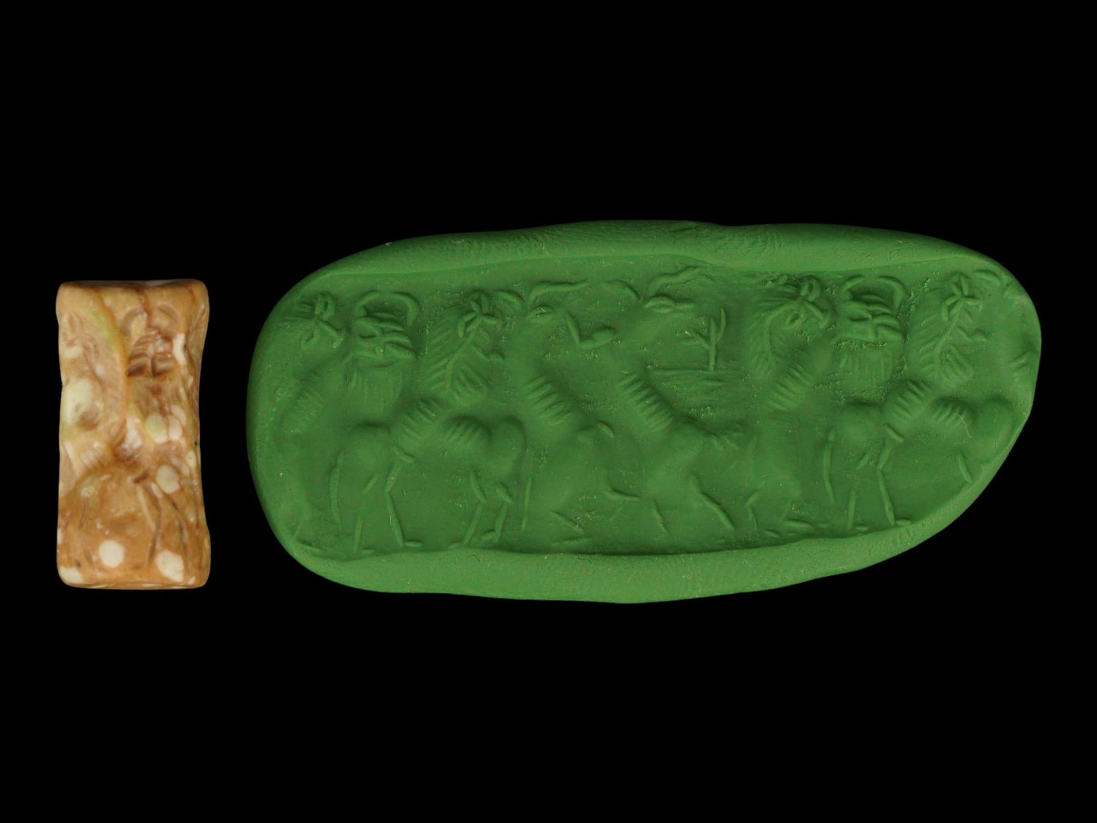 ANCIENT MESOPOTAMIAN CARVED MARBLE CYLINDER SEAL: An ancient Mesopotamian cylinder seal carved from mottled beige-and-orange marble, accompanied by a modern green clay impression. The engraved frieze depicts a dynamic combat scene with a bearded nude