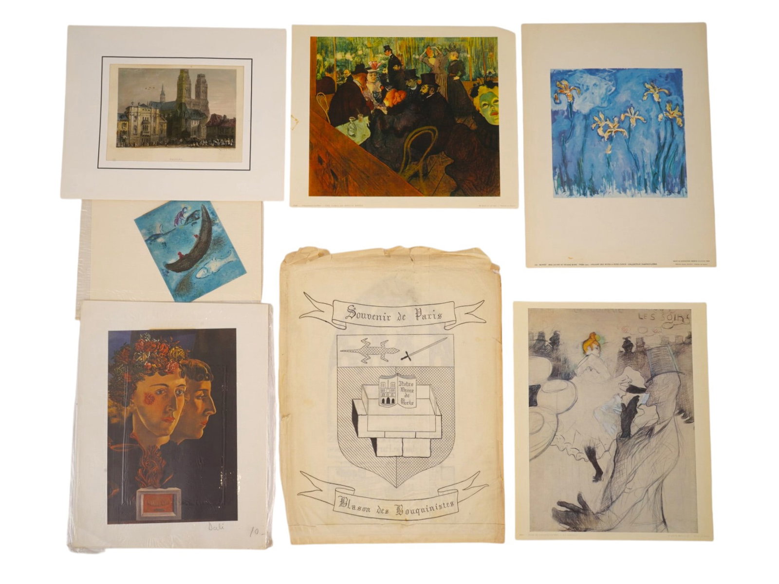 VINTAGE MODERNIST ART PRINTS OF PARISIAN LANDMARKS: A collection of vintage art prints and ephemera featuring famous modernist masters and Parisian landmarks. Highlights include a Souvenir de Paris booksellers crest, a reproduction of Vincent van Goghs