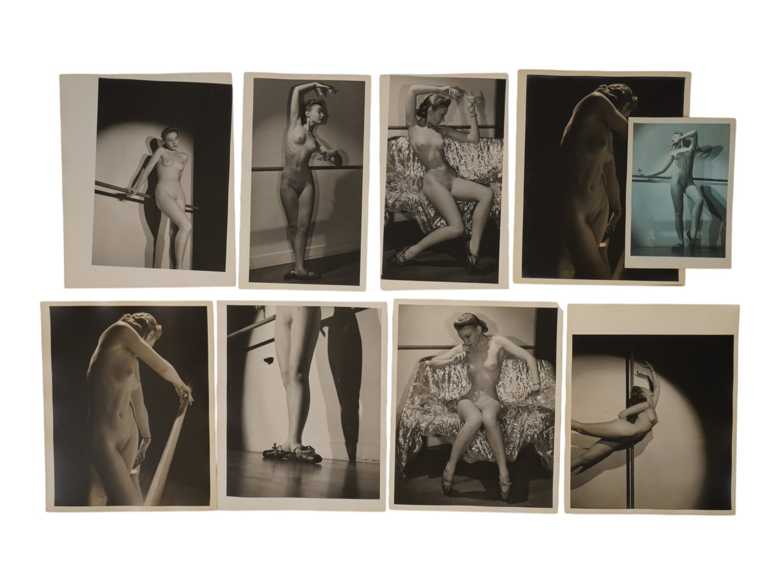 COLLECTION OF VINTAGE FEMALE DANCE EROTIC PHOTOS: A collection of nine vintage black-and-white fine art photographs depicting a female model in dramatic studio and dance poses. The group includes ballet barre studies, seated poses on a draped studio 
