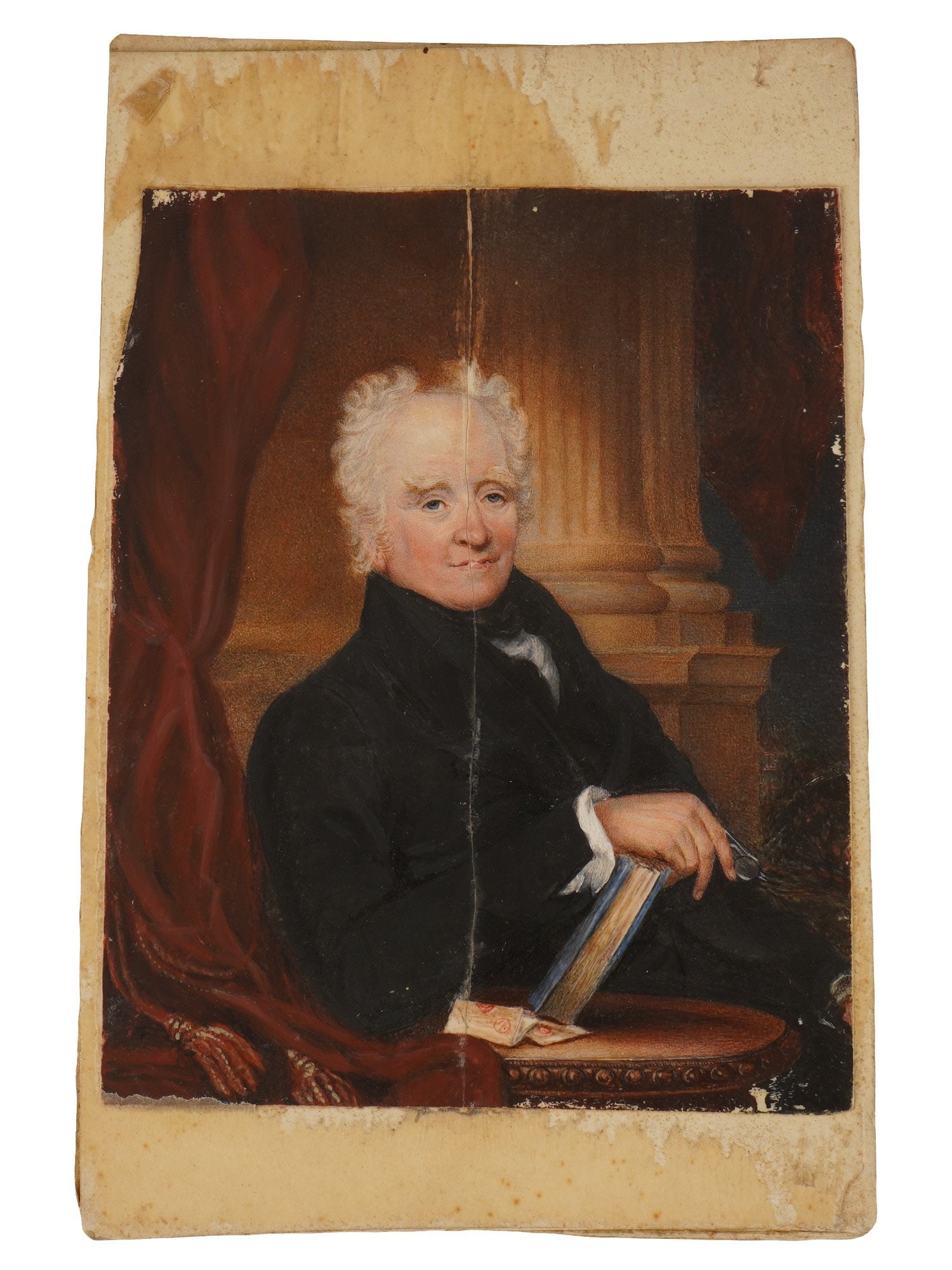 ANTIQUE MINIATURE WATERCOLOR PORTRAIT PAINTING: An antique American school watercolor painting on paper depicting a miniature portrait of a gentleman holding a book. Unsigned. Dates to the late 18th or early 19th century. Bears a provenance label f