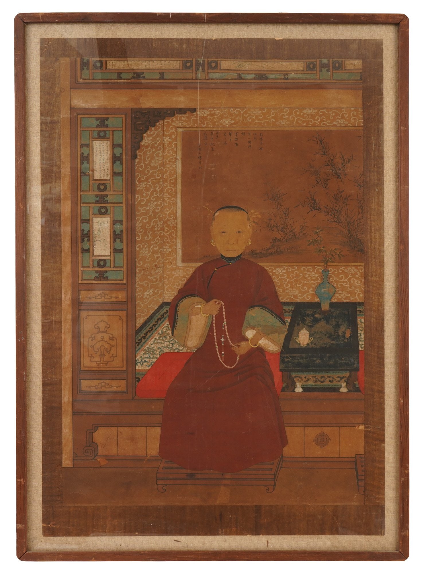 CHINESE ANCESTOR PORTRAIT MIXED MEDIA PAINTING: A traditional Chinese mixed media ancestral portrait created during the Qing Dynasty, 1644 to 1911. The painting depicts an elderly woman of noble birth. She is seated in a richly decorated interior