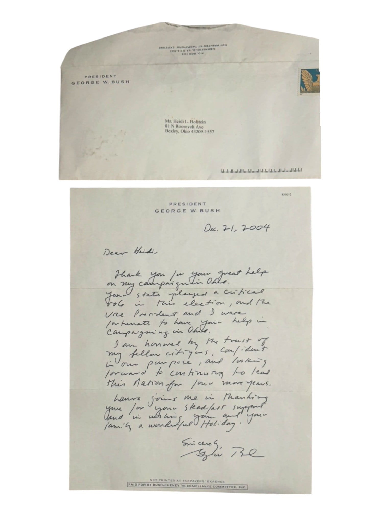 PRESIDENT GEORGE W. BUSH SIGNED LETTER WITH ENVELOPE: A signed letter from President George W. Bush dated December 21, 2004, thanking Heidi L. Holstein for her campaign support in Ohio during the 2004 presidential election. Written in blue ink on