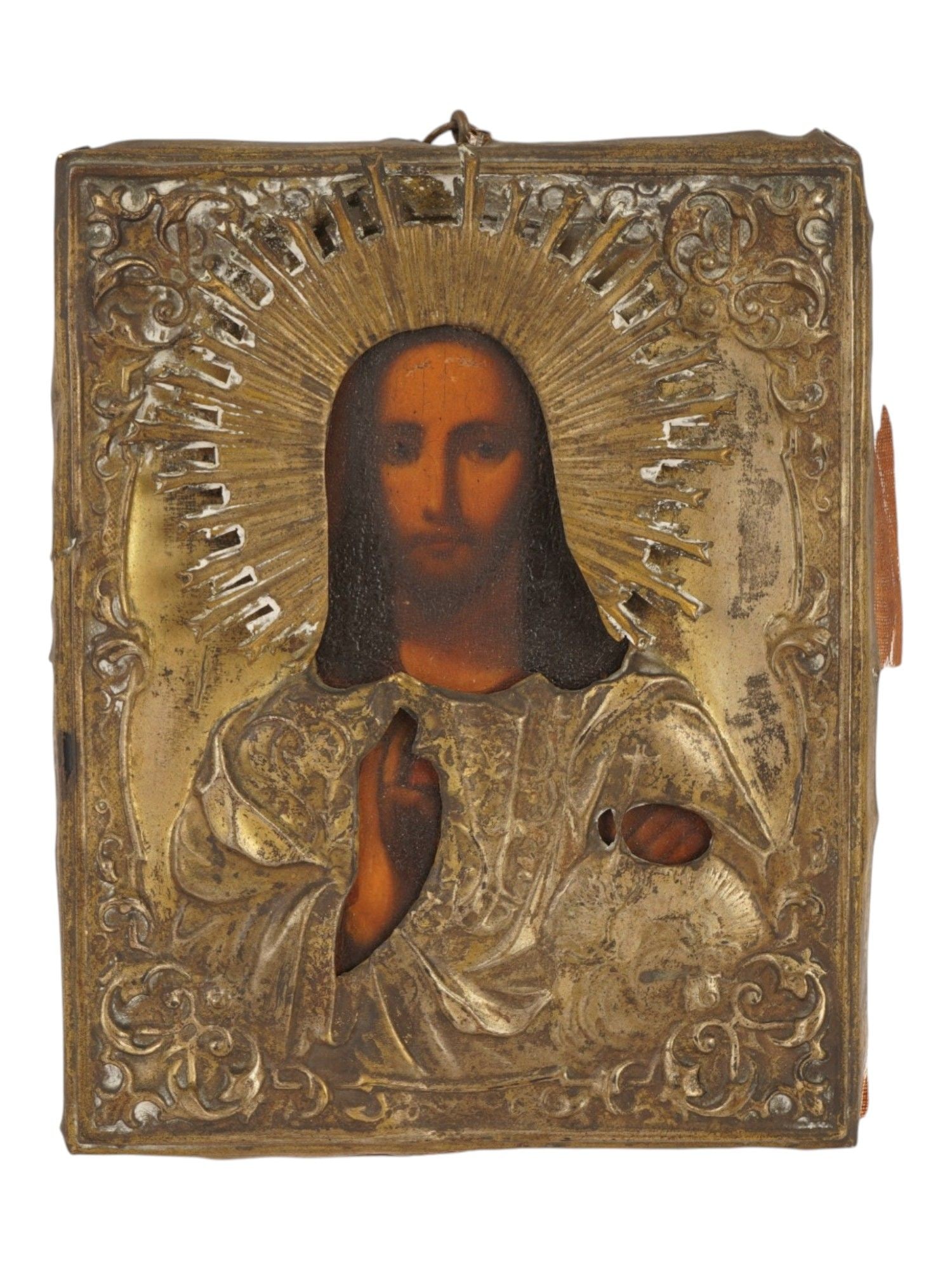 ANTIQUE RUSSIAN ICON OF CHRIST PANTOCRATOR IN RIZA: An antique Russian Orthodox icon depicting Christ Pantocrator. The icon is hand painted in traditional mixed media, using egg tempera over gesso and levkas on a wooden panel. The central figure is