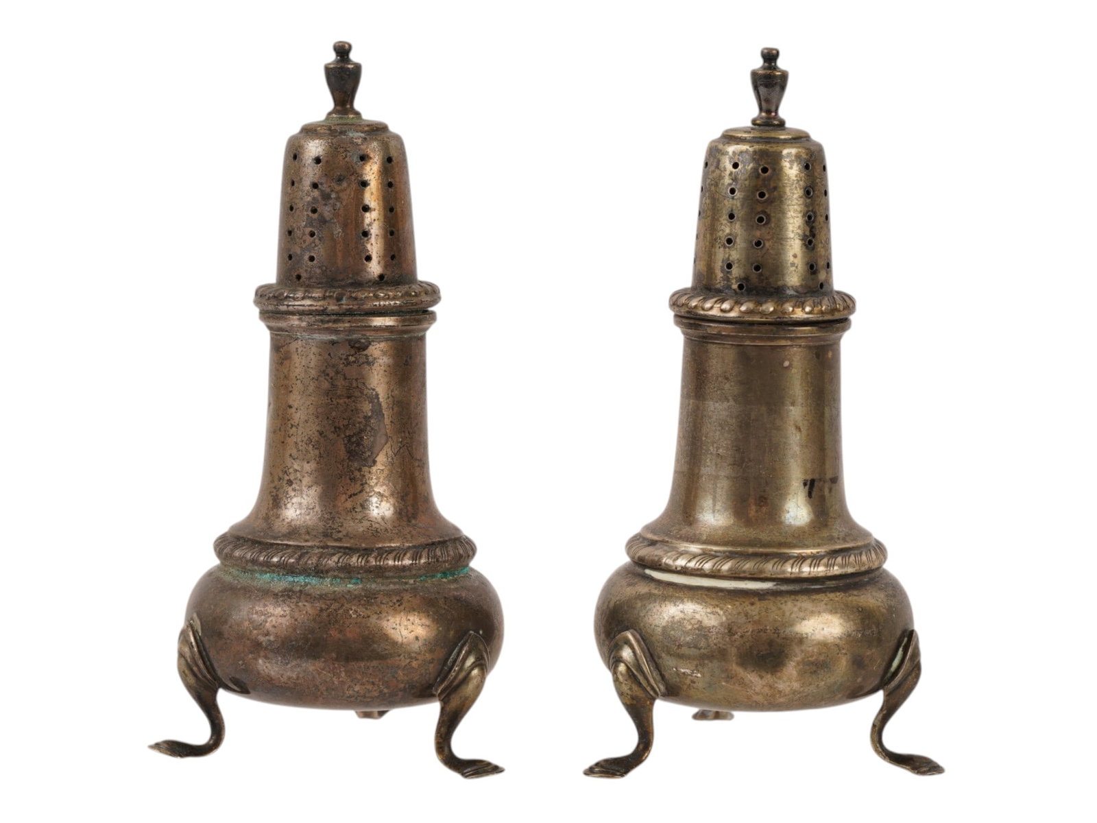 ANTIQUE FRANK M. WHITING SILVER SALT AND PEPPER SHAKERS: A pair of antique sterling silver salt and pepper shakers by Frank M. Whiting and Company, designed in a classical lighthouse form with bulbous bodies, perforated tops, and decorative finials. Each