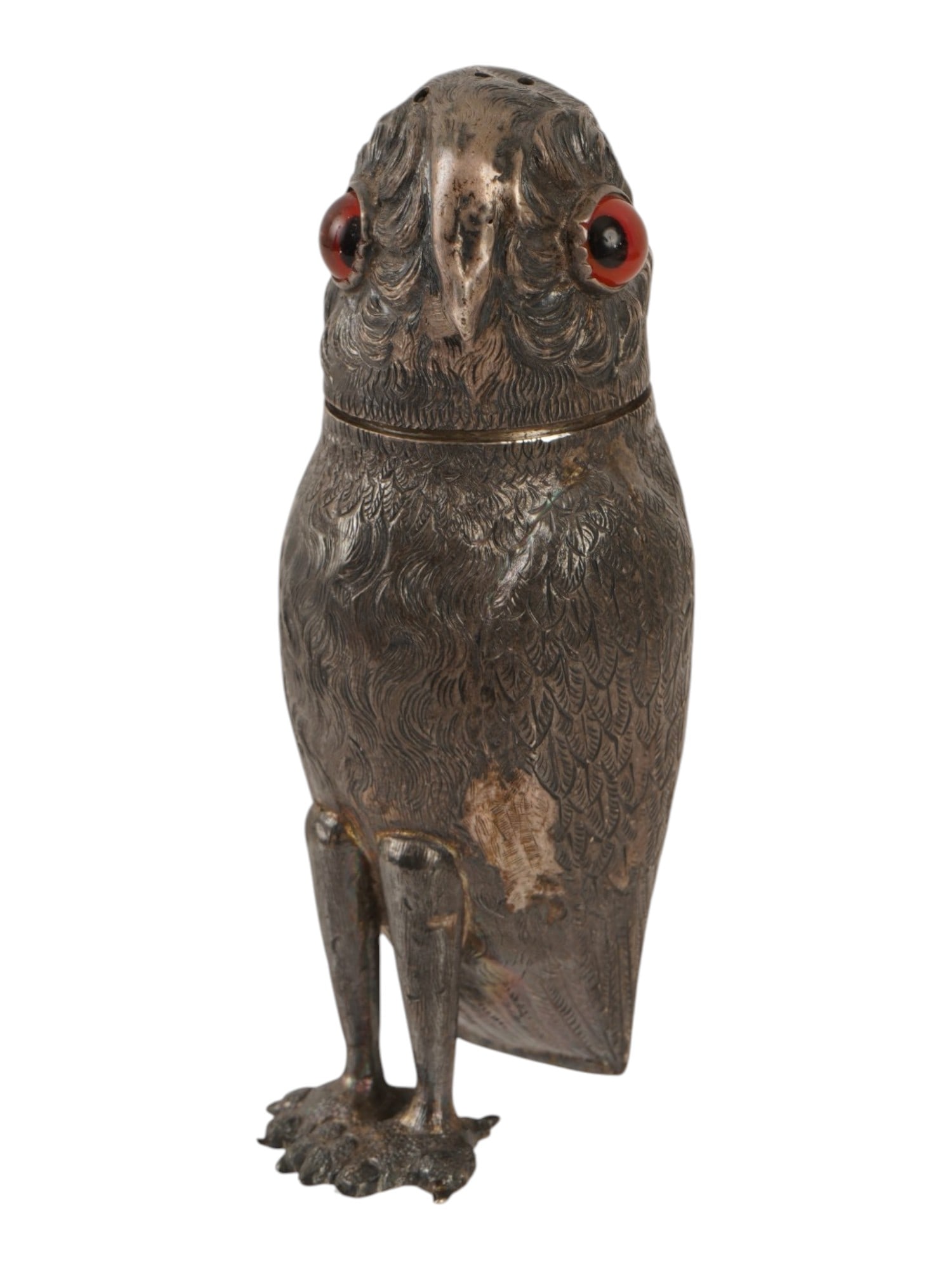 ENGRAVED STERLING SILVER FIGURAL OWL SALT SHAKER: A Sterling Silver figural shaker, modeled as a standing owl with detailed chased plumage and two inset faceted red glass eyes. The head serves as a removable cover, featuring a friction fit collar and