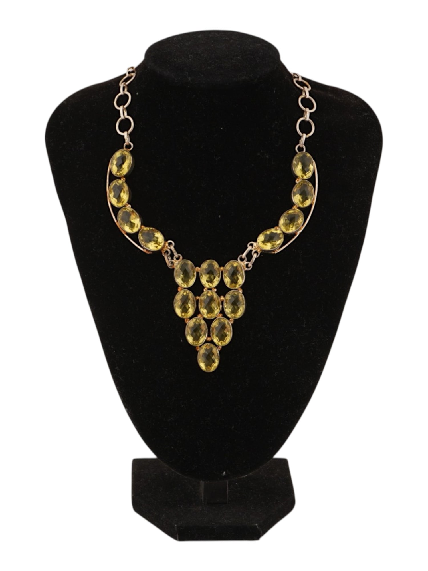 VTG STERLING SILVER BIB NECKLACE WITH CITRINE GEMSTONES: A vintage sterling silver bib necklace set with yellow citrine gemstones. The elegant collar-style design features bezel-set oval citrines leading to a cascading central pendant arrangement. Vintage N