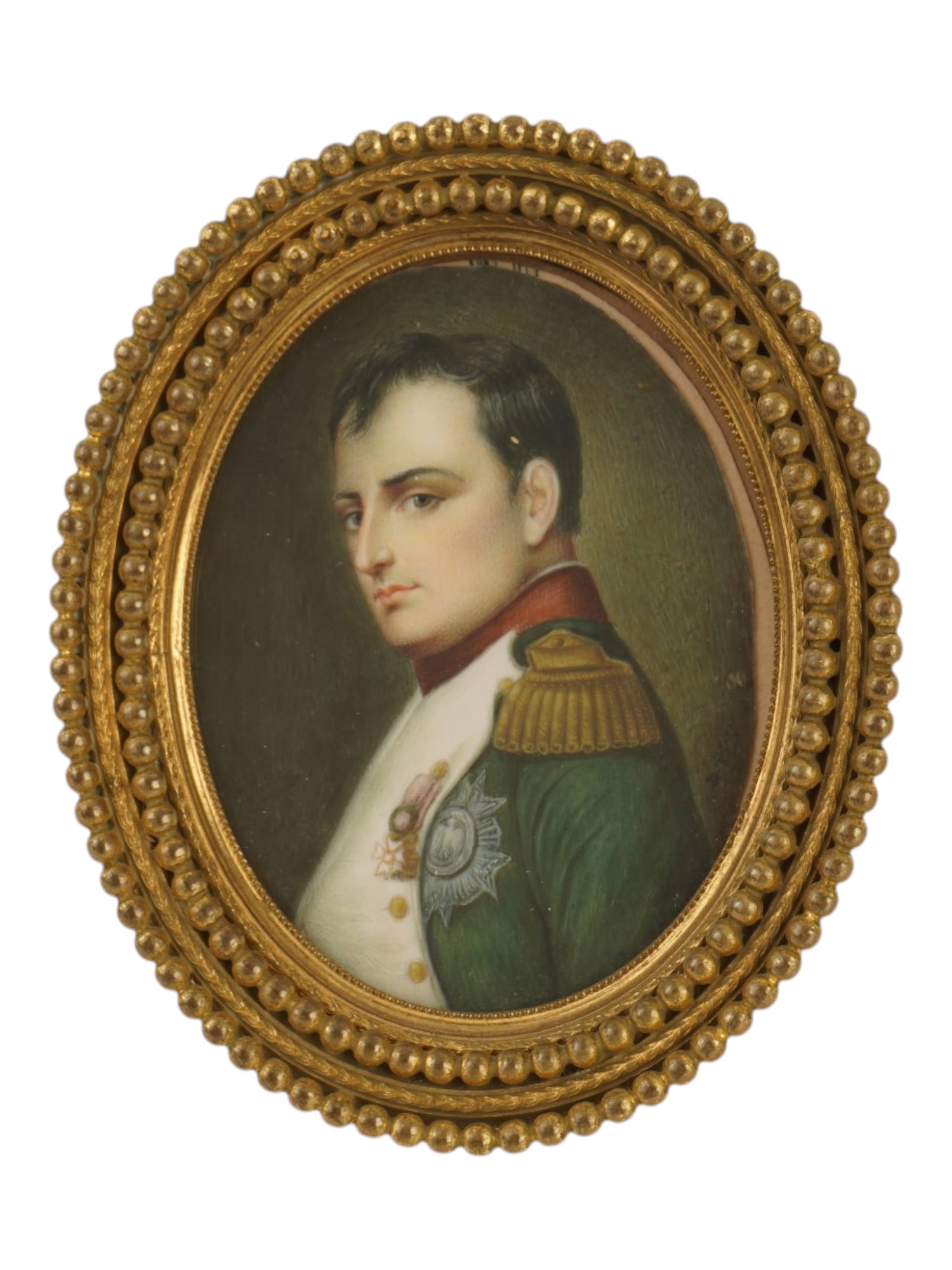ANTIQUE NAPOLEON BONAPARTE PORTRAIT MINIATURE PAINTING: An antique hand painted oval miniature portrait depicting Napoleon Bonaparte in his signature military uniform as Colonel of the Chasseurs a Cheval of the Imperial Guard, featuring a green jacket with