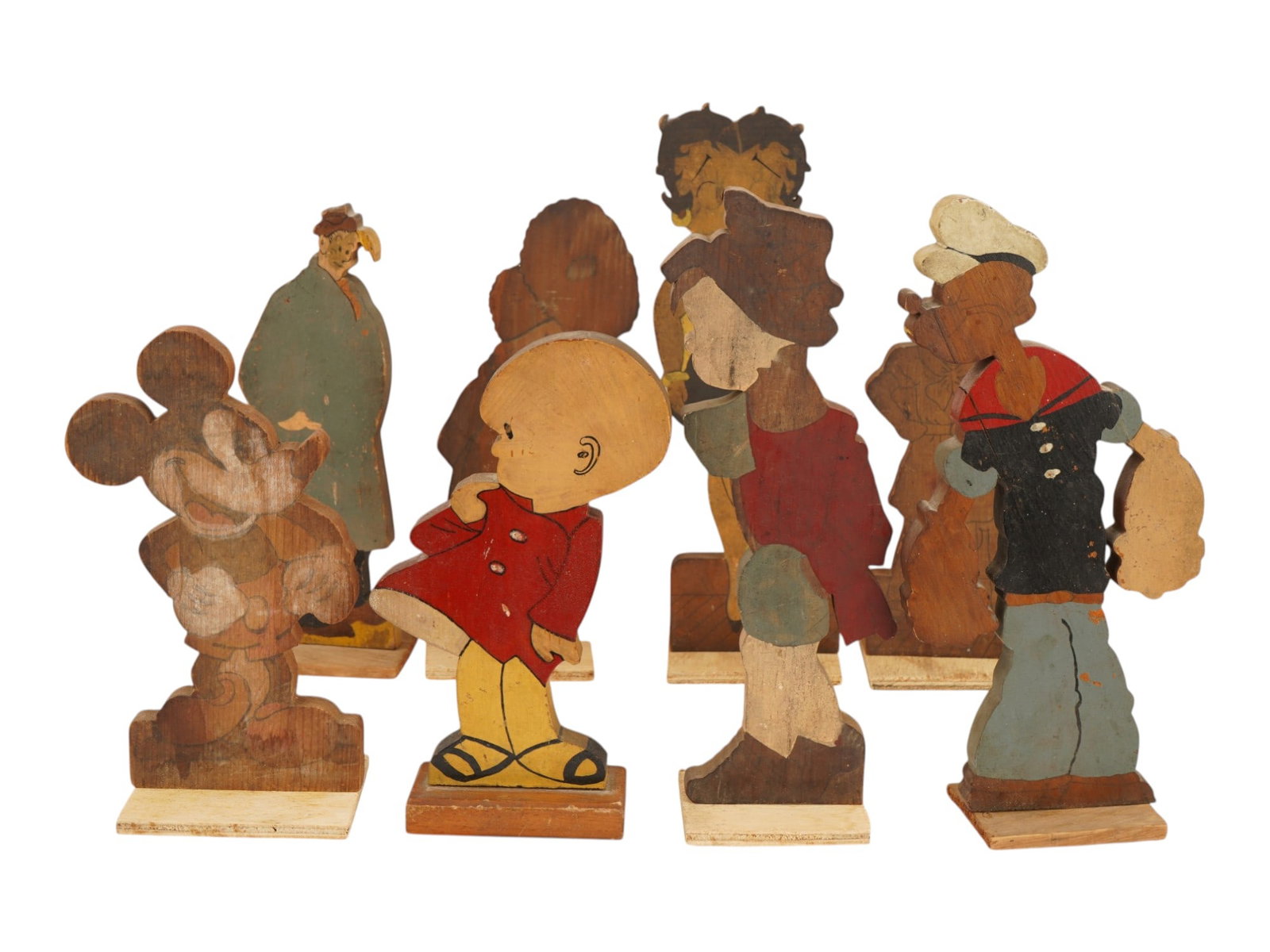 COLLECTION OF VINTAGE WOODEN CARTOON CHARACTERS: A collection of eight flat cut wooden silhouette figures depicting a variety of mid 20th century cartoon characters, including Mickey Mouse, Popeye, Betty Boop, and J. Wellington Wimpy. Each figure is
