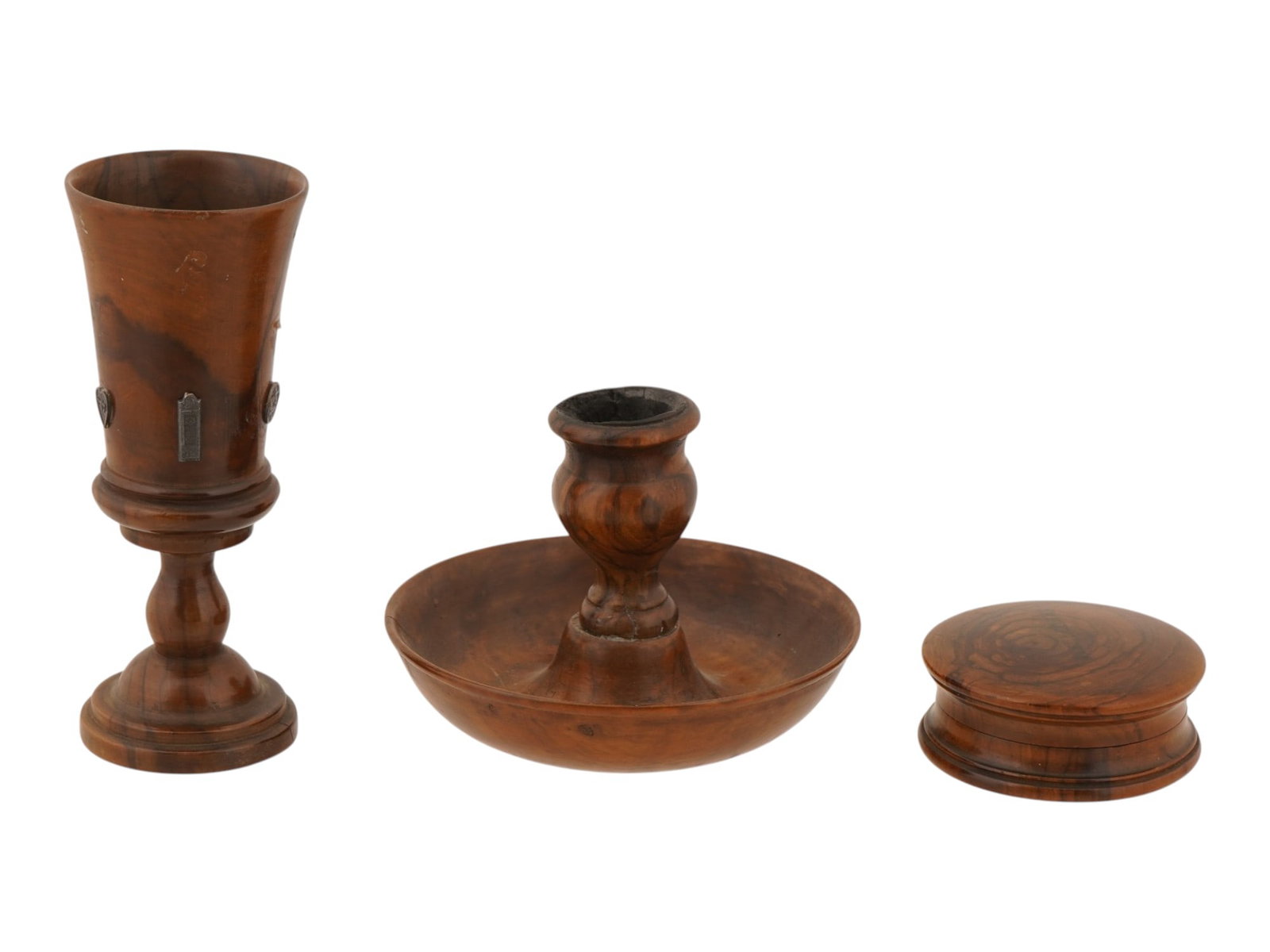 JUDAICA JERUSALEM SOUVENIR OLIVE WOOD SET: A group of three vintage turned olive wood Judaica items. A goblet with metal plaques depicting Magen David, Tablets of the Covenant, and a heart, stamped Jerusalem on the side. A candlestick with a w