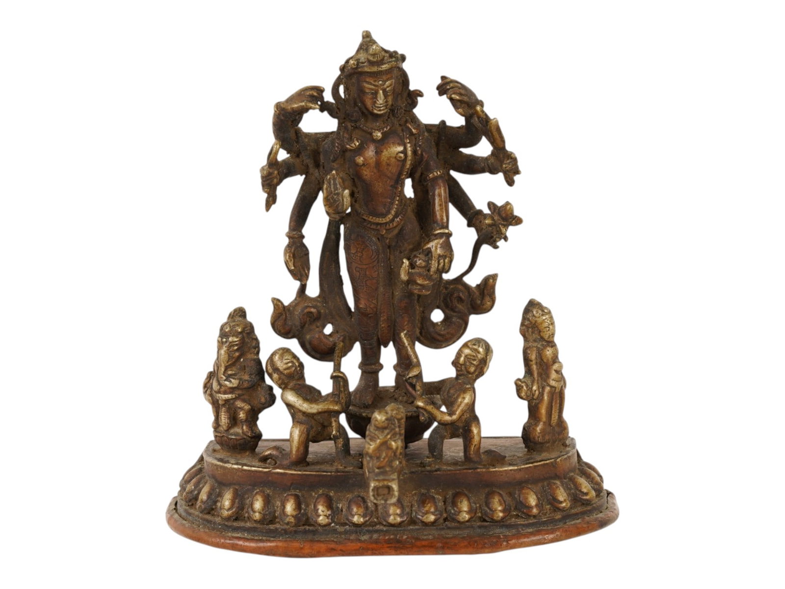INDIAN GOLD PATINATED BRONZE FIGURE OF DURGA GODDESS: An Indian gold patinated bronze sculpture depicting the goddess Durga as Mahishasuramardini, standing in a triumphant pose upon a semi circular lotus pedestal. The deity is flanked by four smaller