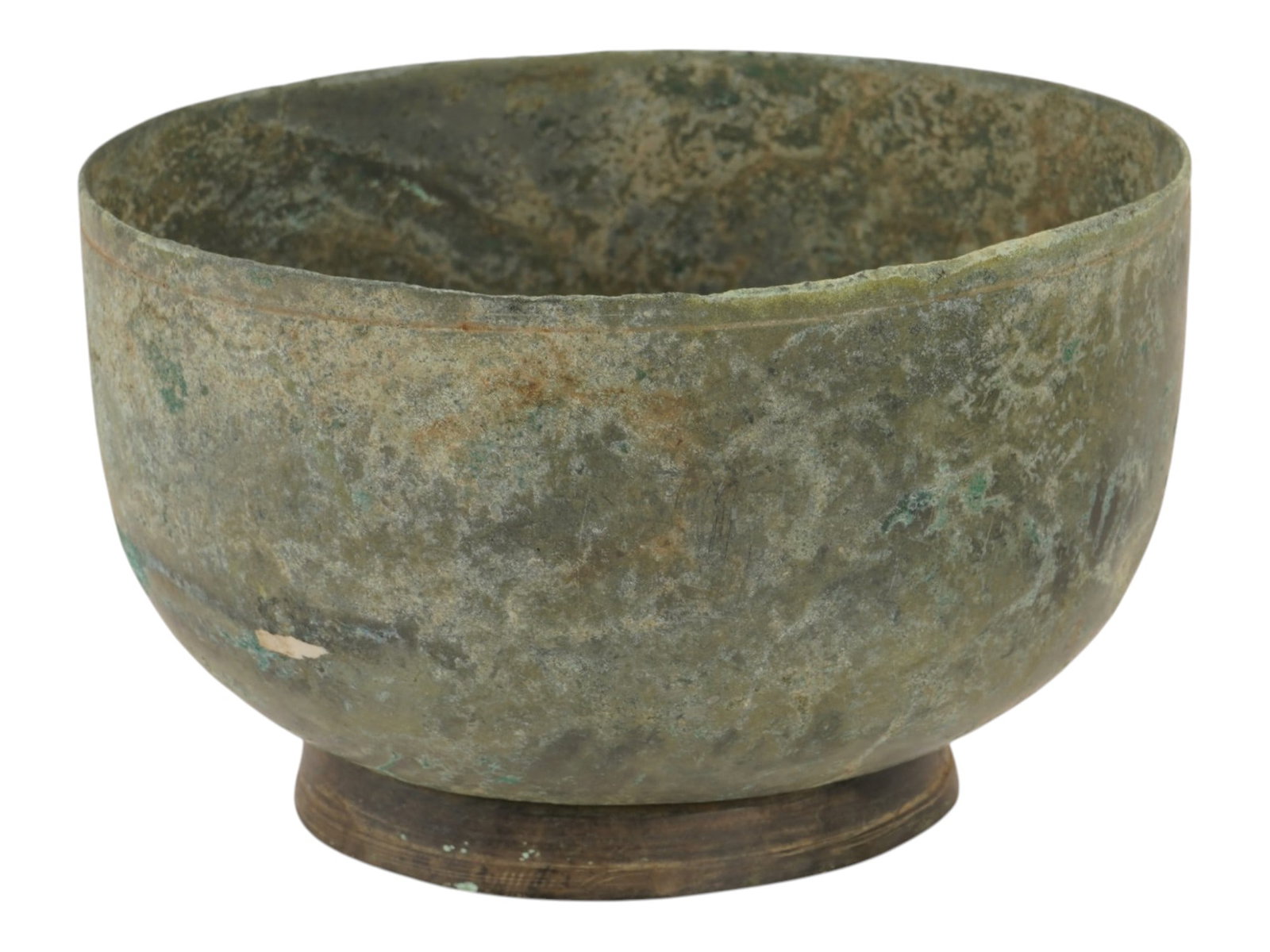 ANTIQUE METAL BOWL W WEATHERED GREEN VERDIGRIS PATINA: An antique metal bowl with a deep hemispherical form, slightly incurved sides, and a simple un-flanged rim. The exterior displays a heavily weathered green verdigris patina with earthy mineral