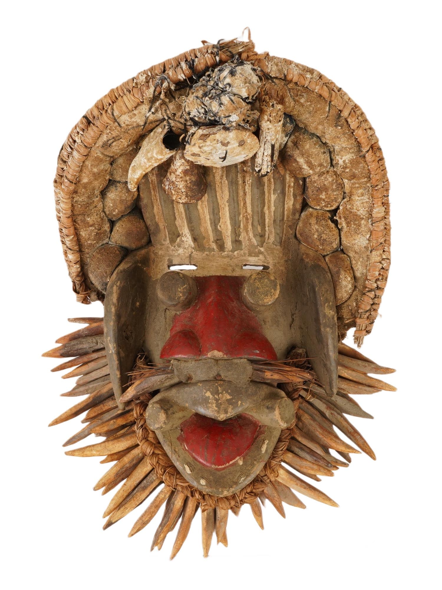 TRADITIONAL AFRICAN IVORY COAST GUERE FETISH MASK: An African Guere fetish mask from the Ivory Coast, created for protective and ritual use within the community and believed to safeguard the entire village from evil spirits and harmful forces. The mas