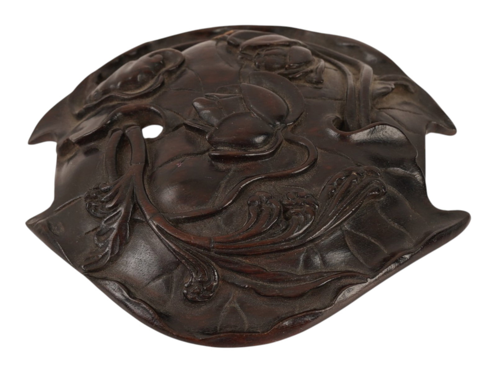 ASIAN CARVED HARDWOOD DRAGON DESIGN BELT BUCKLE: An Asian oval shaped belt buckle, crafted from dark hardwood. The ware features a high relief carving of a traditional dragon amidst stylized clouds. The piece is designed with two central circular pe