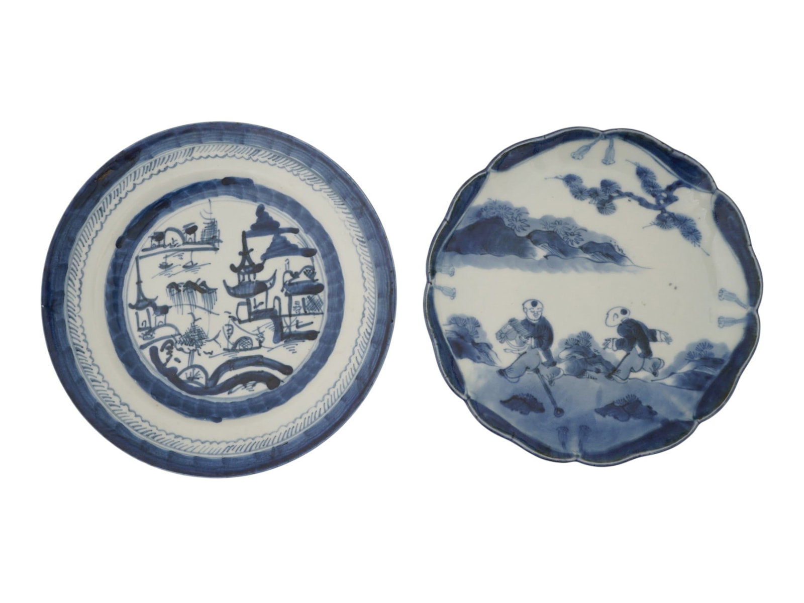 LOT OF CHINESE BLUE AND WHITE PORCELAIN PLATES: A lot of two circular form porcelain plates decorated in underglaze blue. The first plate features a traditional landscape composition with pagodas, a bridge, and a stylized border, marked, China, on 