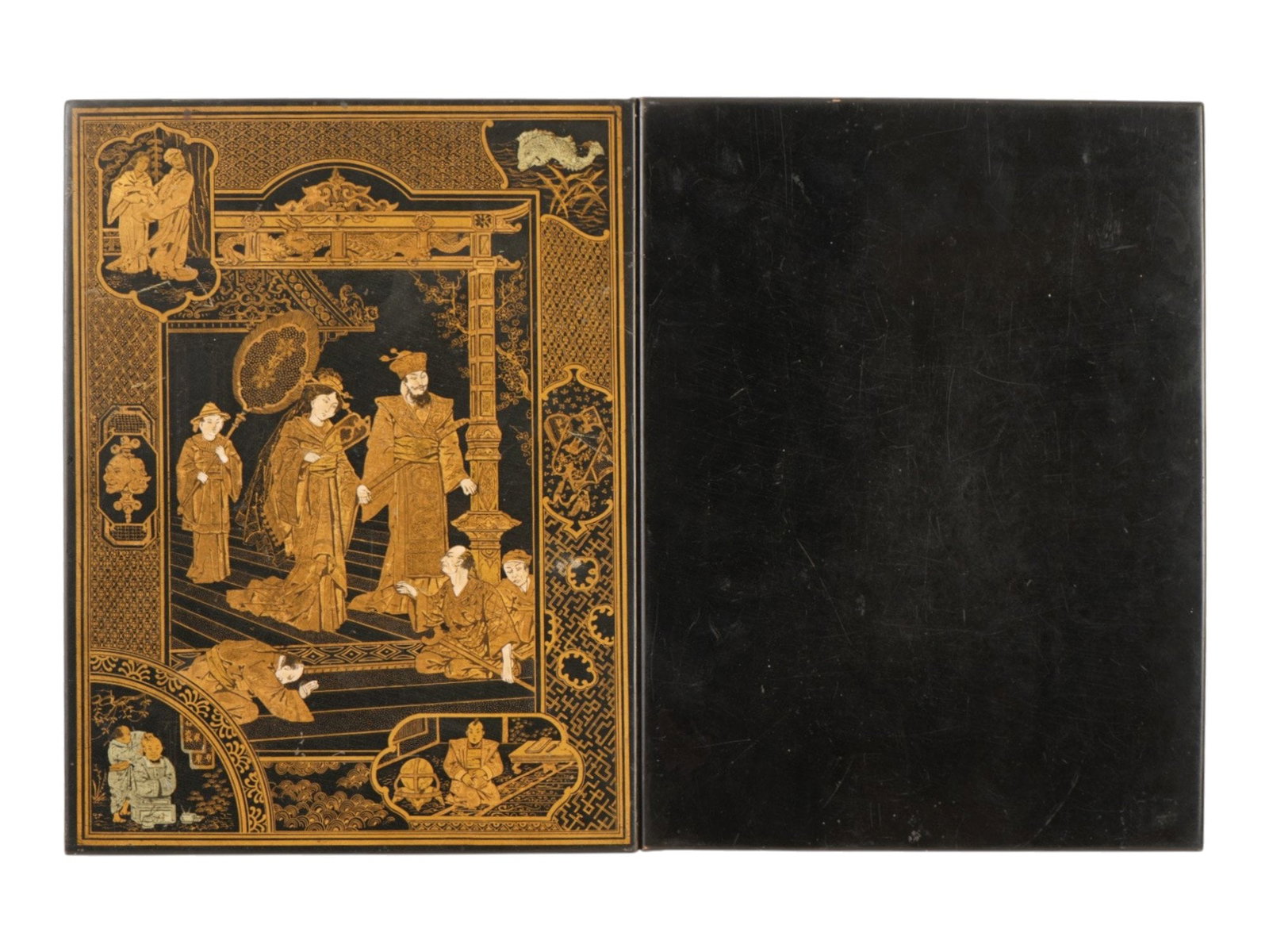 ANTIQUE CHINESE FOLDER W GOLD ON LACQUER PAINTING: An antique Chinese paper folder with gold painting on black lacquer. Late Qing era, before 1912. The cover of the folder depicts a traditional court scene with well detailed figures in period costume.