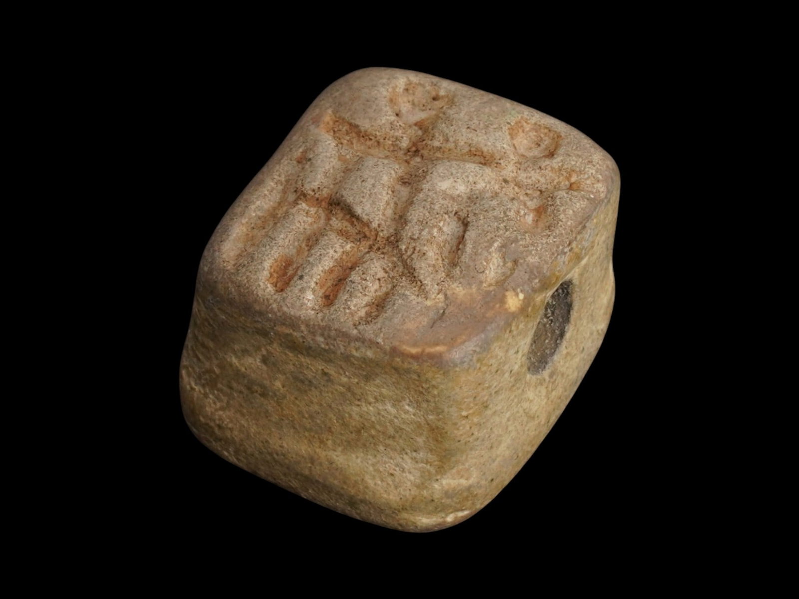 ANCIENT NEAR EASTERN STONE SEAL 2ND TO 1ST MILLENNIUM BC: An ancient Near Eastern hand carved stone stamp seal. Circa: from the 2nd to the 1st Millennium BC. The item is a rectangular stamp with an engraved image representing a rider on a horse and an angel.
