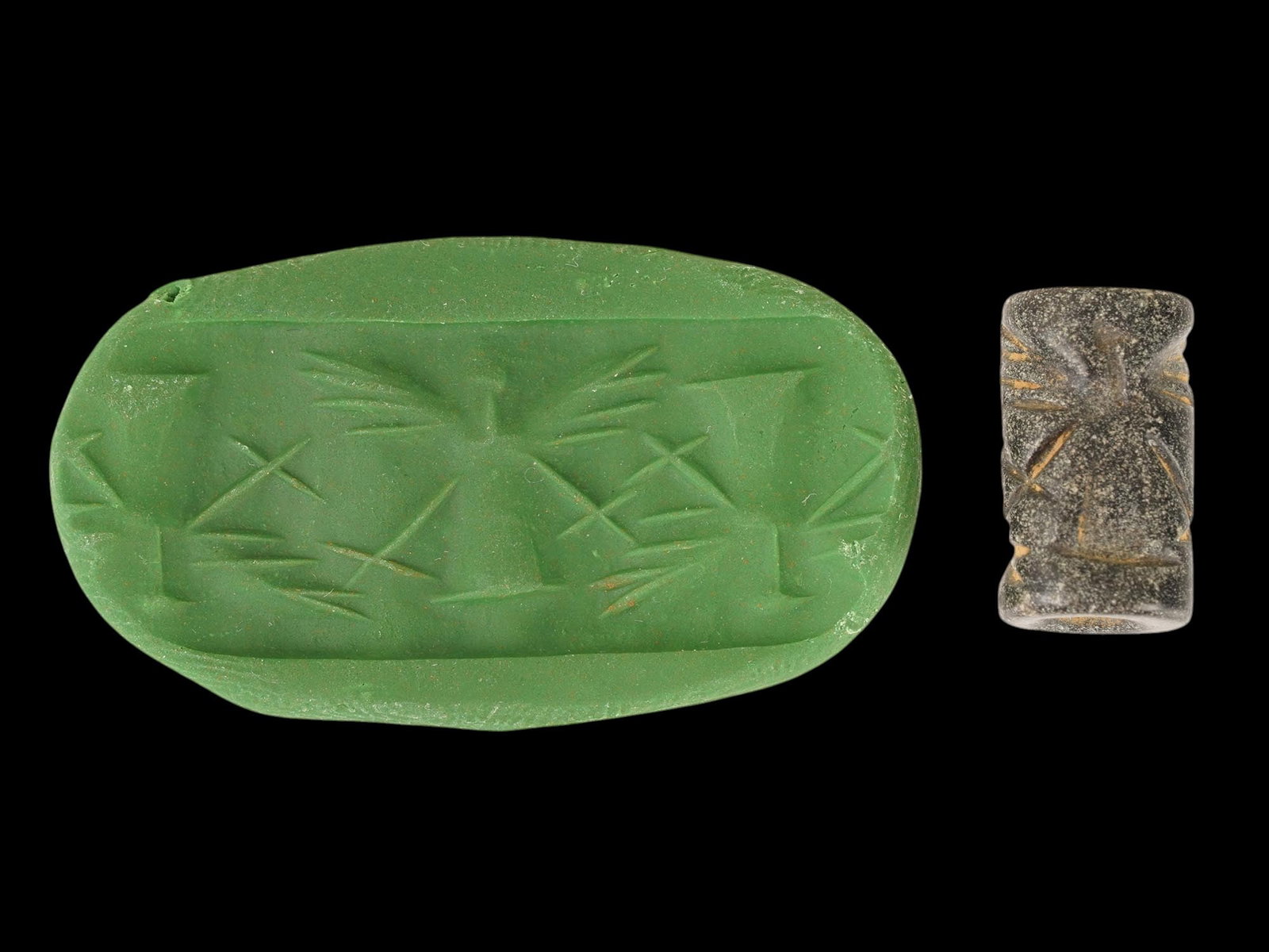 ANCIENT WESTERN ASIATIC CARVED STEATITE STONE SEAL BEAD: An ancient Western Asiatic carved Steatite stone seal bead of cylinder shape, circa the 2nd to the 1st Millennium BC. The seal is engraved with a ritual scene with mythological winged figures. Ancient