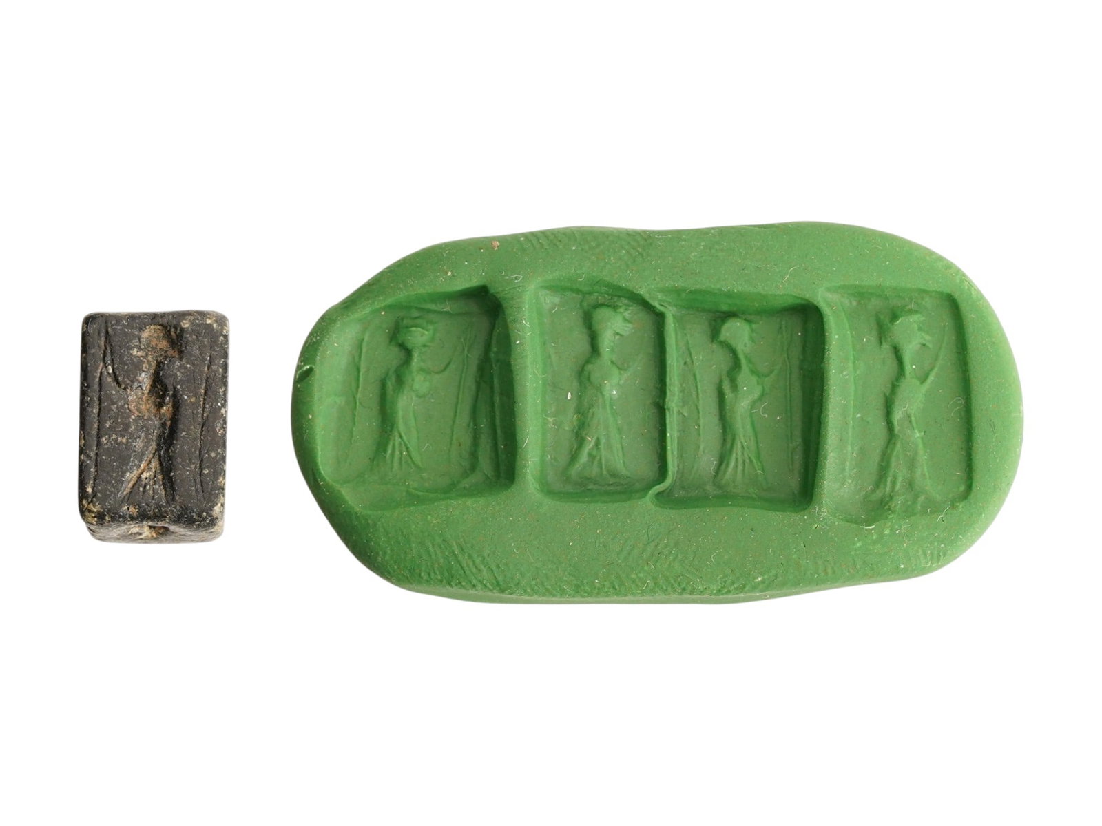 ANCIENT NEAR EASTERN ENGRAVED STEATITE STAMP SEAL: An ancient Near Eastern rectangular steatite stamp seal, dating ca. 1st to 2nd Millenium BC. The dark stone block is meticulously engraved on all four primary faces with stylized figures, including a 