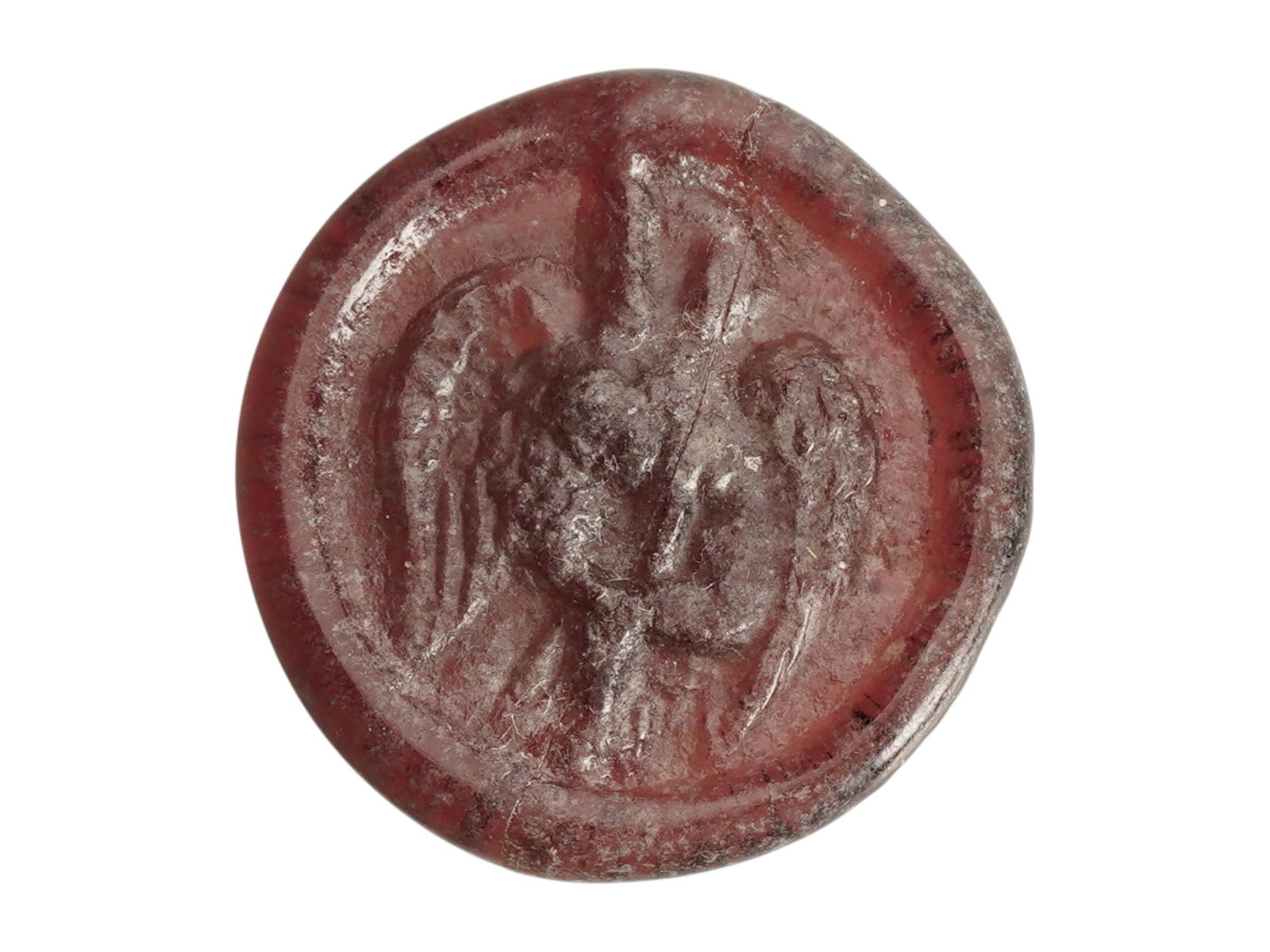 ANCIENT ROMAN GLASS MEDALLION 100 TO 300 AD: An ancient Roman burgundy glass intaglio medallion, dating ca. 100 to 300 AD. The obverse features a molded relief depicting the mythological scene of Leda and the Swan. The circular disc shows a slig