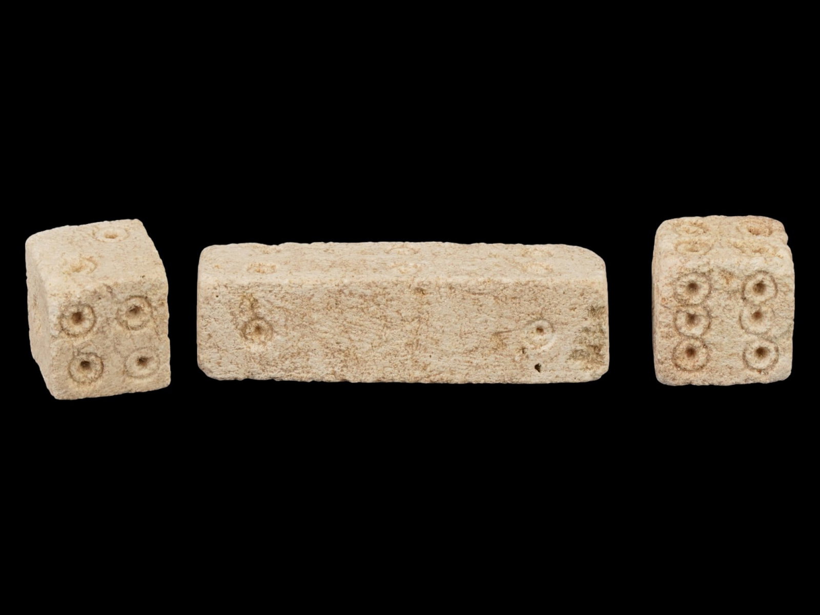 3 ANCIENT ROMAN CARVED STONE DICE CA 100 TO 300 AD: A group of three ancient Roman carved stone dice of elongated rectangular shape and square shape. Imperial Rome era, ca. 100 to 300 AD. Square shape. Collectible Archaeological Finds And Relics, Stone