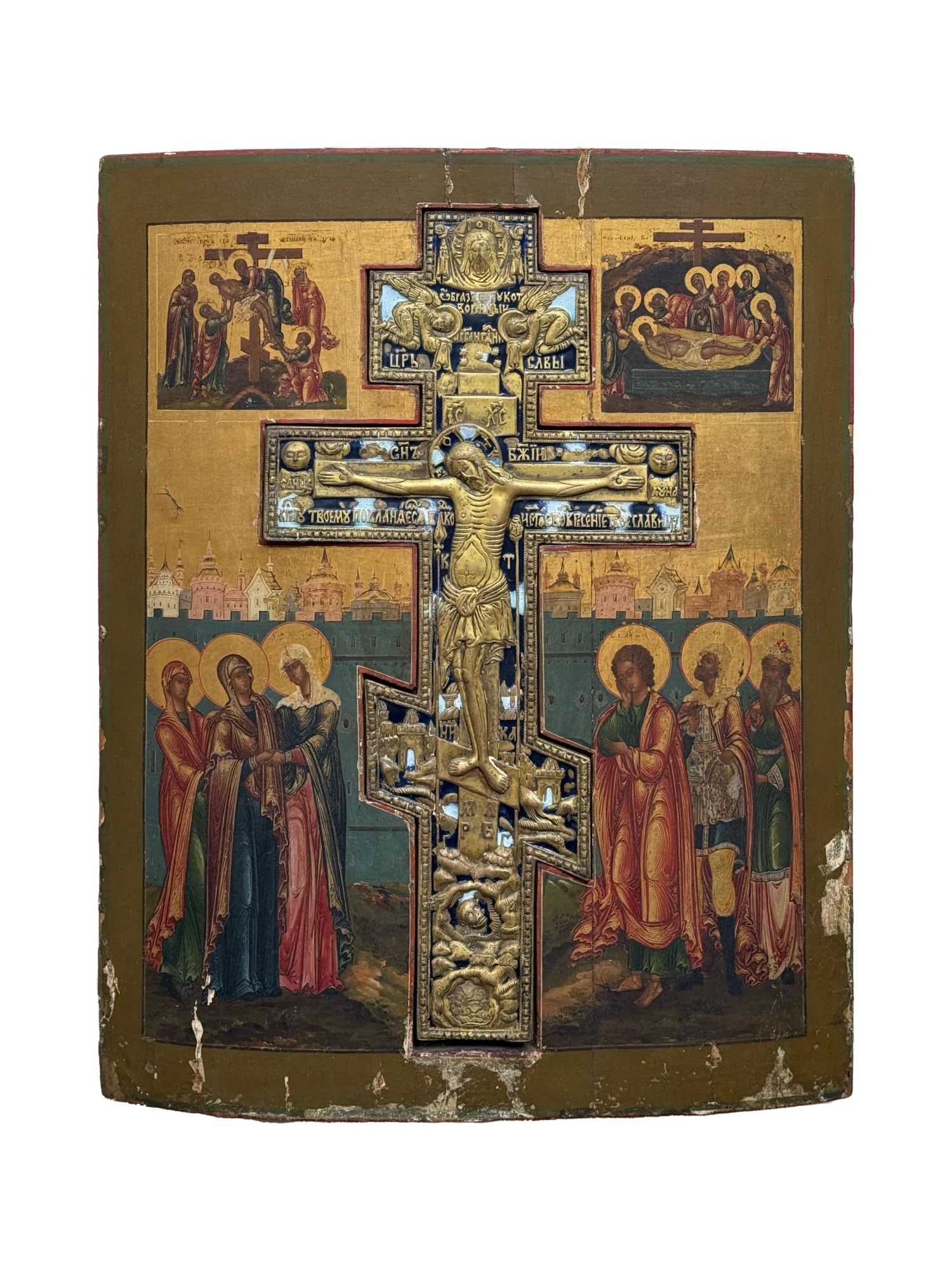 ANTIQUE 19TH C RUSSIAN ORTHODOX STAVROTHEK ICON: An antique 19th-century Russian Orthodox stavrothek icon depicting the Crucifixion with Passion scenes. Mixed media painting: egg tempera, gesso, and levkas on wood board. Set with an enameled brass c