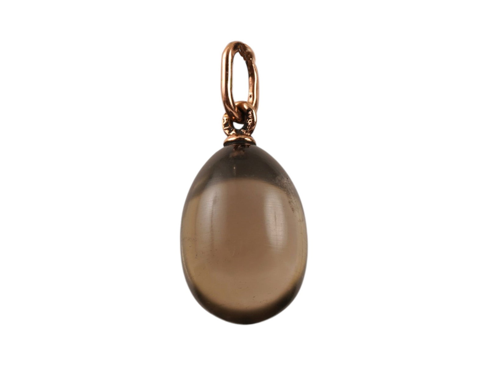 RUSSIAN 14K GOLD AND CARVED QUARTZ EASTER EGG PENDANT: A Russian Easter egg pendant hand carved of Smokey Quartz with 14k gold fittings to the body. Marked on the fitting ring with a 56 Russian gold standard for 14K gold, and the makers marks. Hand Carved