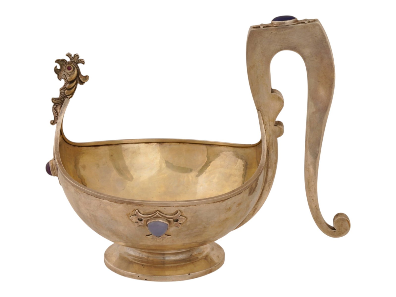 LARGE RUSSIAN SILVER AND GEMSTONE ROOSTER KOVSH: A large Russian silver kovsh, a traditional oval-shaped drinking vessel or ladle with a single handle. Rounded piece with hooked handle. The front is shaped as a roosters head with ruby cabochon