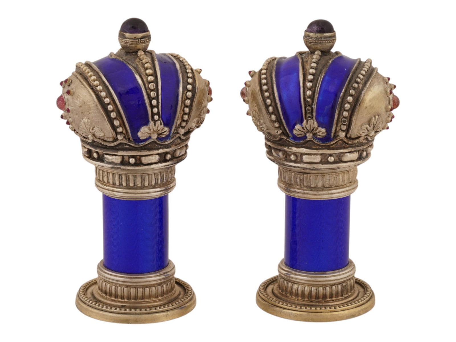 PAIR OF RUSSIAN SILVER GUILLOCHE ENAMEL TORAH FINIALS: A pair of Russian gilt-silver and guilloche enamel Torah finials, or Rimmonim, decorated with royal blue enamel and set with cabochon amethysts and ruby accents. The finials feature silver beneath