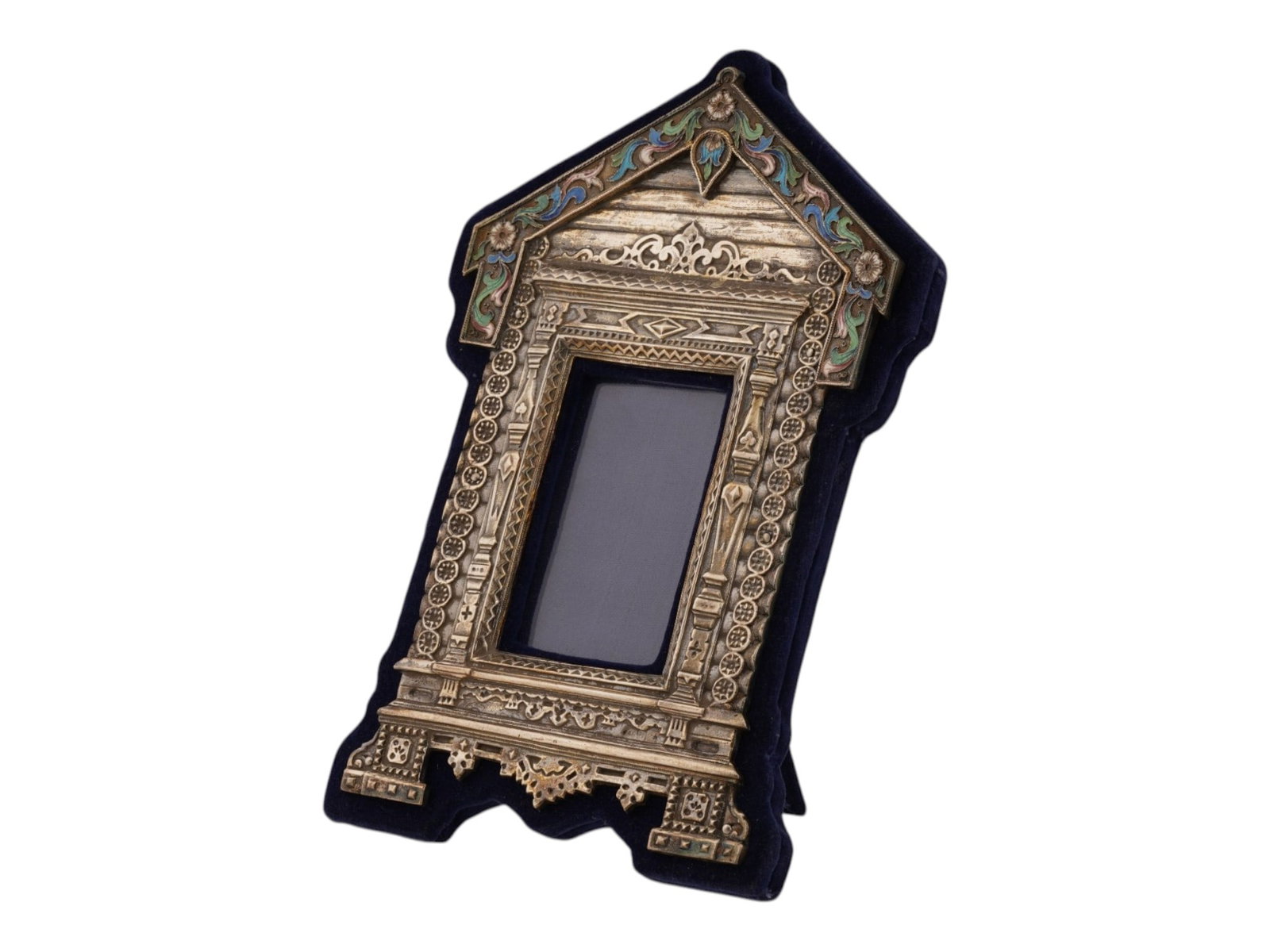 RUSSIAN SILVER ENAMEL CARVED SLAVIC IZBA PICTURE FRAME: A Russian silver picture frame in the form of a carved Izba, traditional Slavic village house. Decorated with stylized floral polychrome enamel patterns created in the cloisonne technique. The back