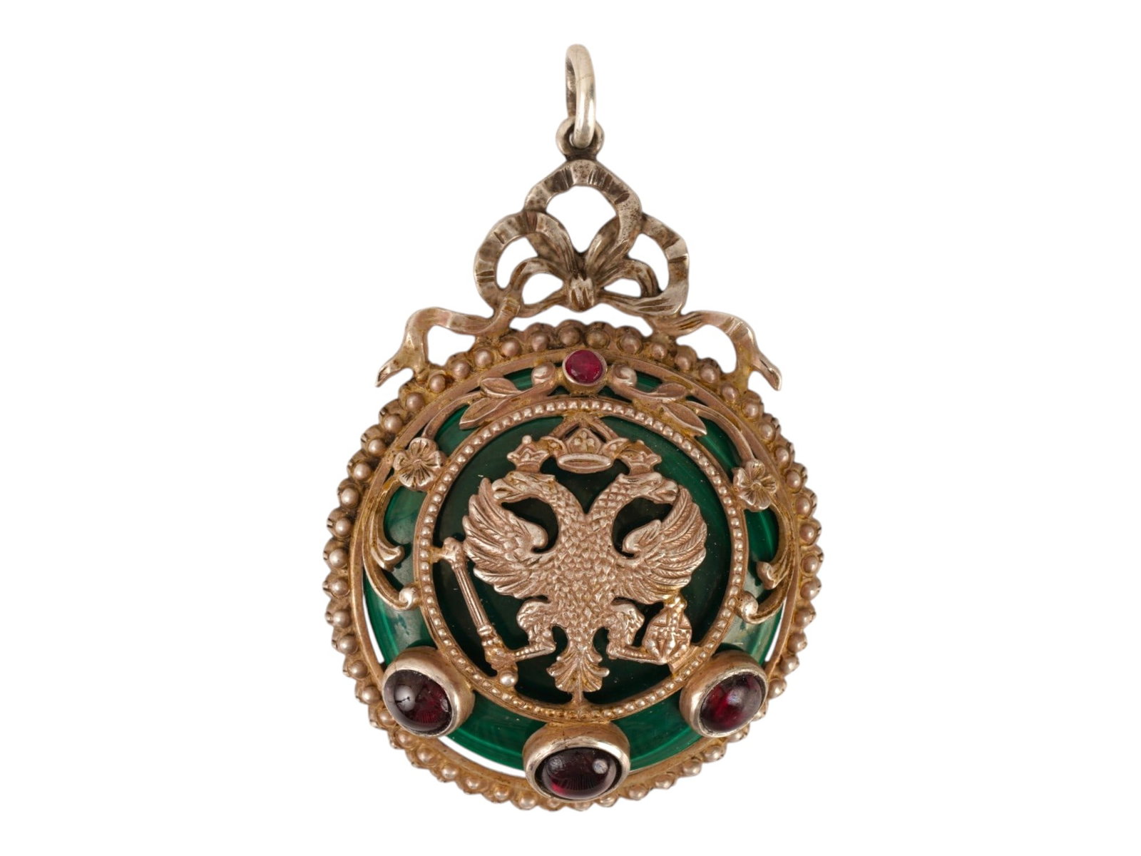 LARGE RUSSIAN SILVER MALACHITE RUBY GARNETS PENDANT: A large Russian Imperial presentation gilt silver and malachite pendant. The hand carved malachite pendant is adorned with a figural gilt silver frame in the shape of an Imperial double head eagle