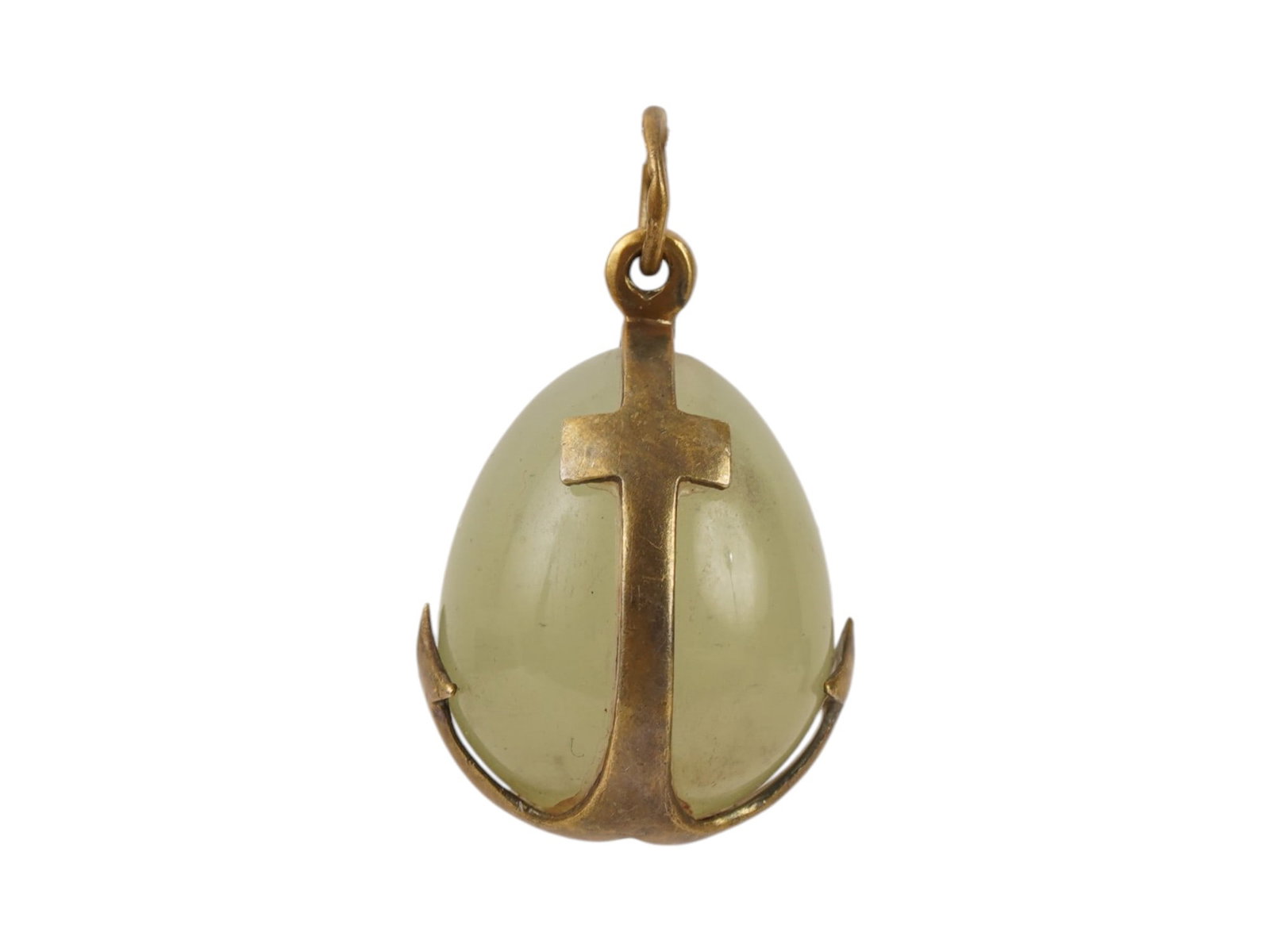 RUSSIAN SILVER AND BOWENITE EASTER EGG PENDANT: A Russian carved bowenite stone Easter egg pendant. Encase in a gilt silver anchor motif. Hallmark of 84 silver standard and makers mark are on the fitting ring. Weight: 4.19 g. Russian Jewelry,