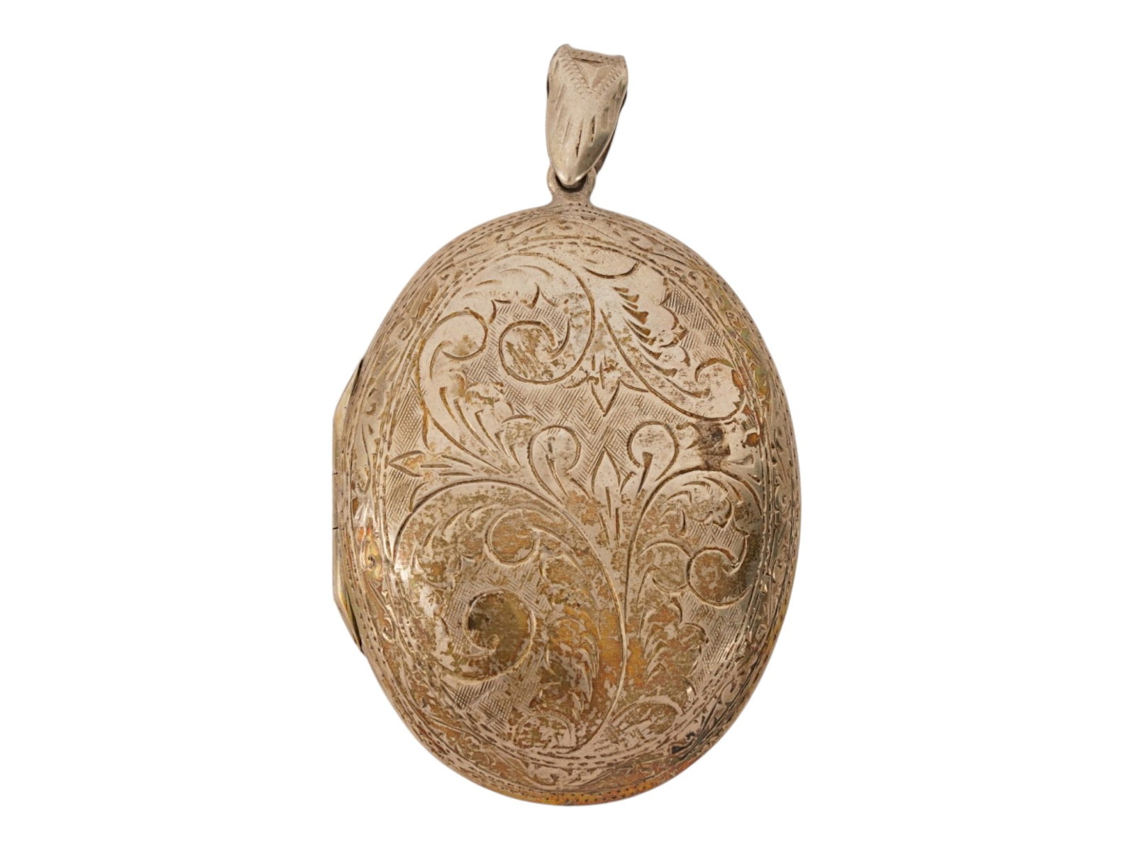 ANTIQUE GILT STERLING SILVER LOCKET PENDANT: An antique gilt sterling silver locket pendant. The oval-shaped locket with a hanging ring at the top. Decorated with an engraved floral pattern. Holes for inserting photographs are located inside.
