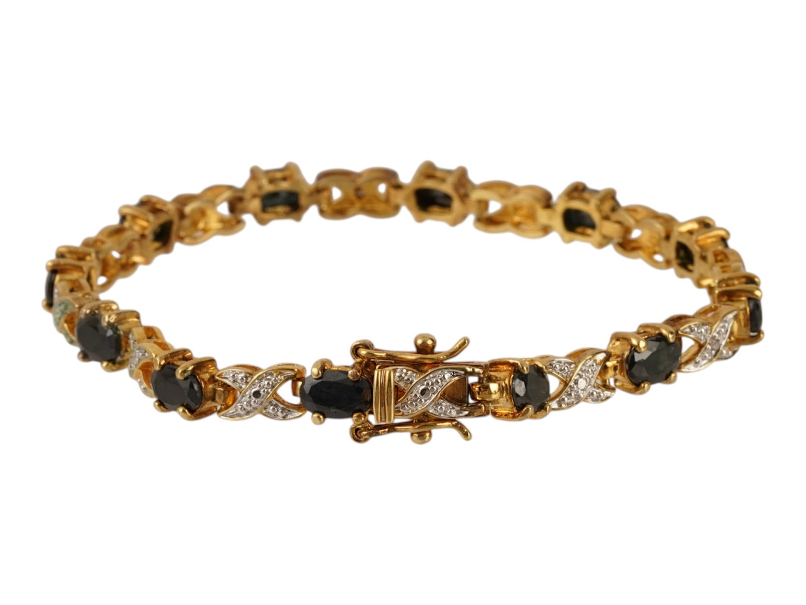 VINTAGE GILT STERLING SILVER GEMS LINK BRACELET: A gilt sterling silver link bracelet. Embellished with alternating oval-cut black gemstones and riveted X motif. Box clasp, marked 925, PAJ, China. Weight: 11.9 g. Vintage Jewelry And Fashion