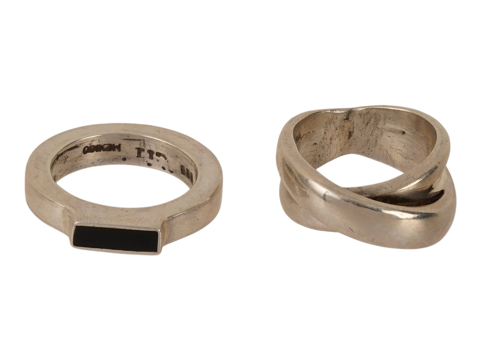PAIR OF VINTAGE MODERNIST STERLING SILVER RINGS: A pair of vintage sterling silver rings. A Mexican band ring with black-enameled crown. Double ring piece. Both are marked 925 inside. Vintage Statement Jewelry And Fashion Accessories. THIS LOT IS