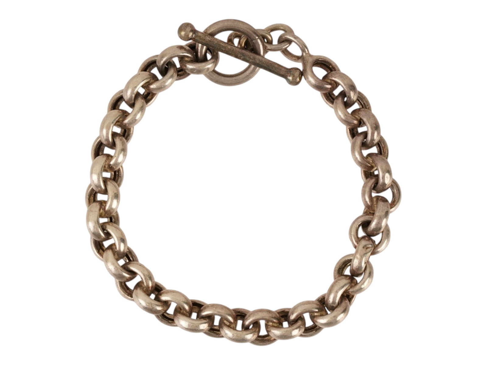 ITALIAN STERLING SILVER TOGGLE LINK CHAIN BRACELET: An Italian Sterling Silver bracelet featuring a substantial chain composed of uniform, circular links. The piece utilizes a functional toggle closure system consisting of a polished T bar and a circul