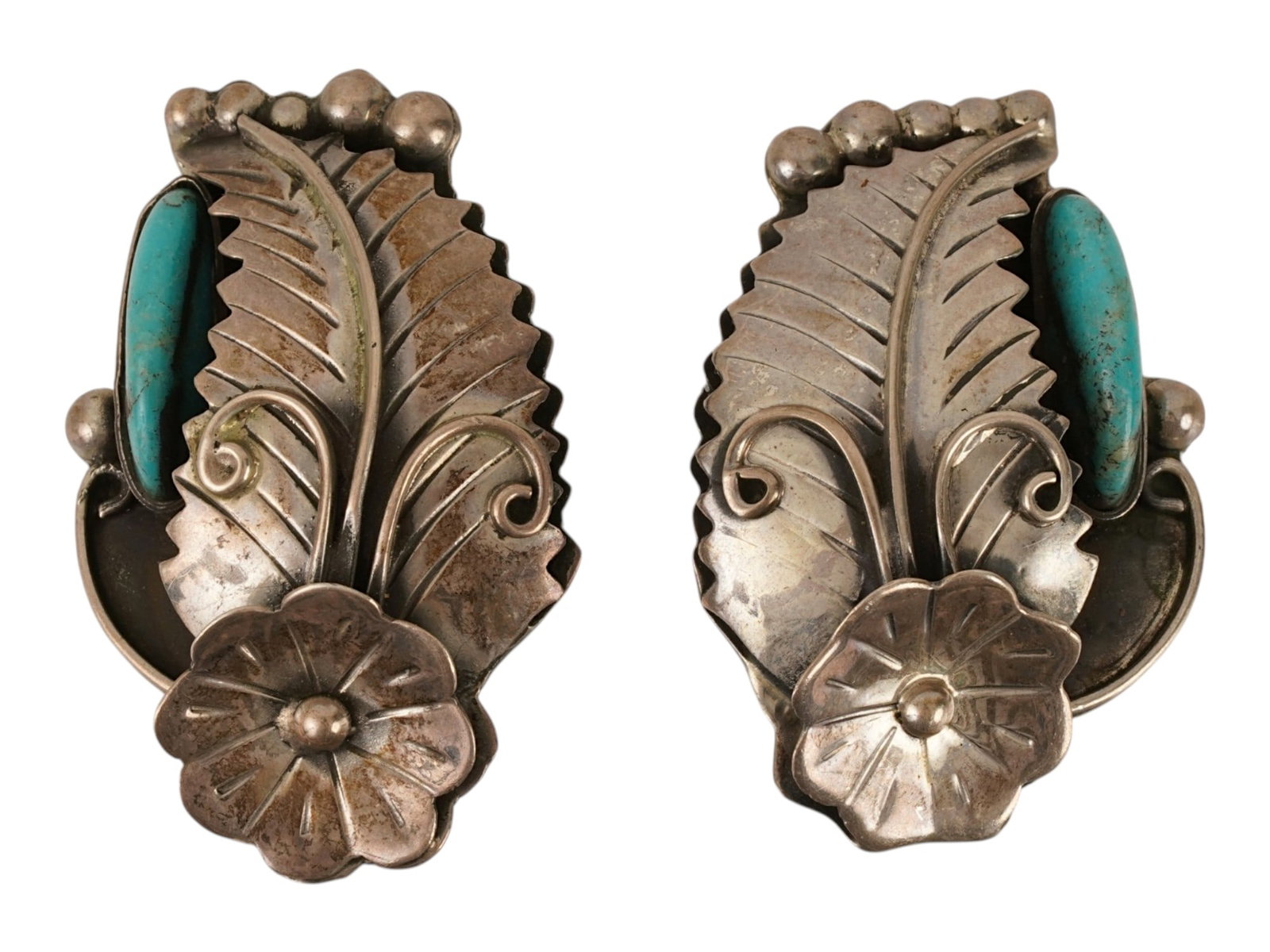 MEXICAN STERLING SILVER AND TURQUOISE CLIP EARRINGS: A pair of Mexican sterling silver clip-on earrings. Flower and leaf design, set with turquoise. Marked CII 925 Mexico on the backside. Weight: 27.7 g. Vintage Jewelry And Fashion Accessories, Old Pawn
