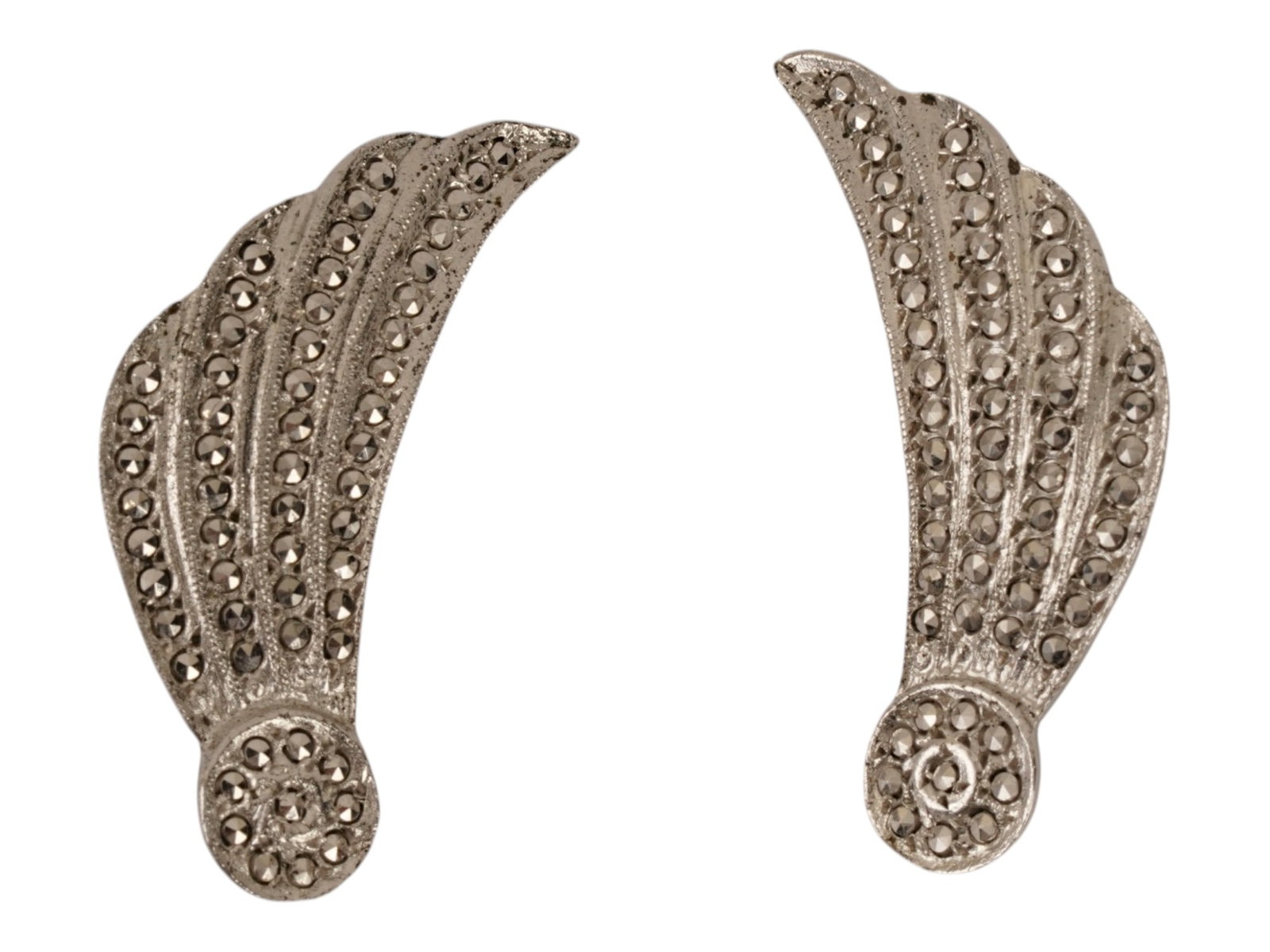 PAIR MARCASITE STERLING SILVER WING SCREW BACK EARRINGS: A pair of sterling silver earrings featuring a dynamic wing shaped design, meticulously pave set with numerous round cut marcasite stones. The reverse of each earring is stamped with a Sterling hallma