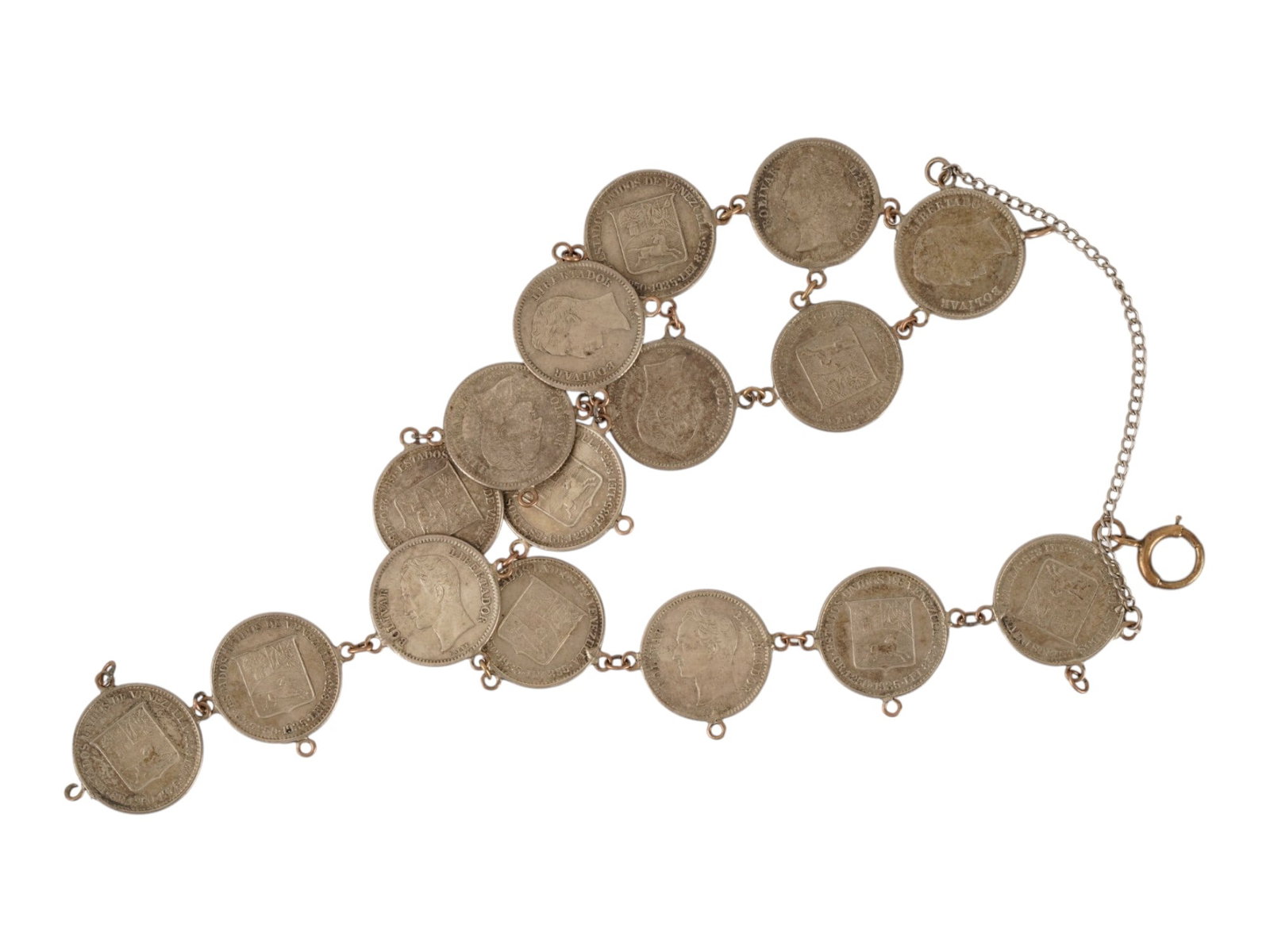 VINTAGE VENEZUELAN SILVER COIN LINK BRACELET BOLIVARES: A vintage Venezuelan silver coin link bracelet, hand-assembled from mid-20th-century Bolivares featuring portraits of Simon Bolivar and Venezuelan coat of arms designs. The coins are connected with si