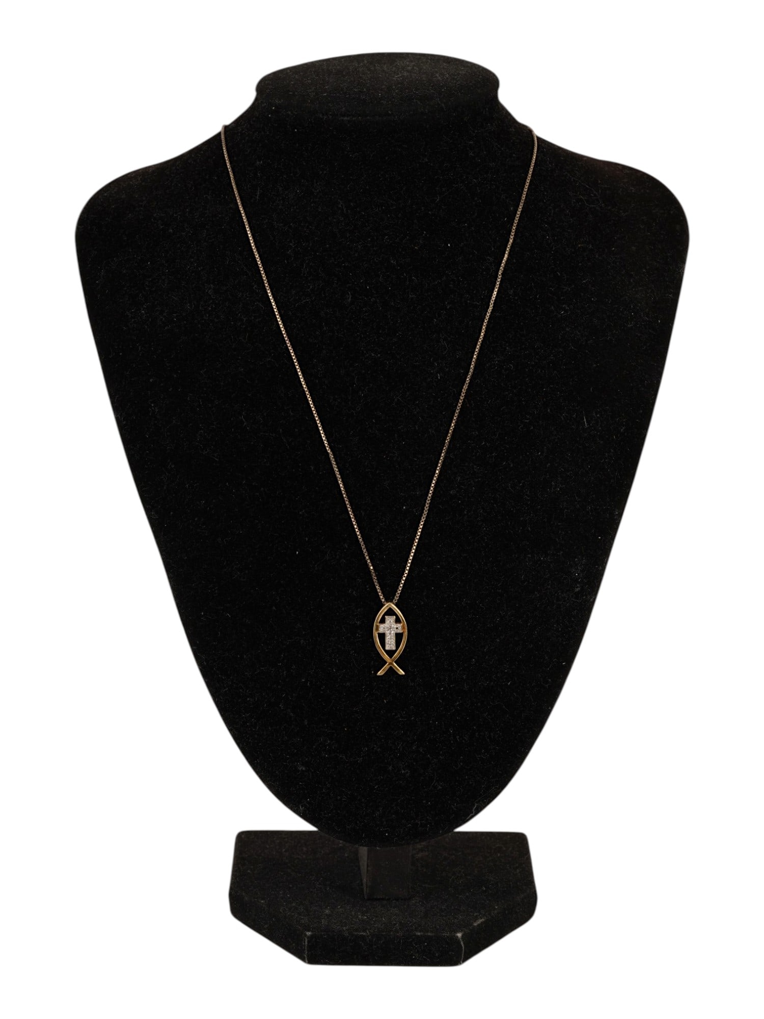VINTAGE STERLING SILVER DIAMOND CROSS PENDANT NECKLACE: A vintage sterling silver Christian Ichthys fish and cross pendant necklace. The polished fish-shaped frame encloses a small diamond-accented Latin cross, combining two important symbols of the Christ