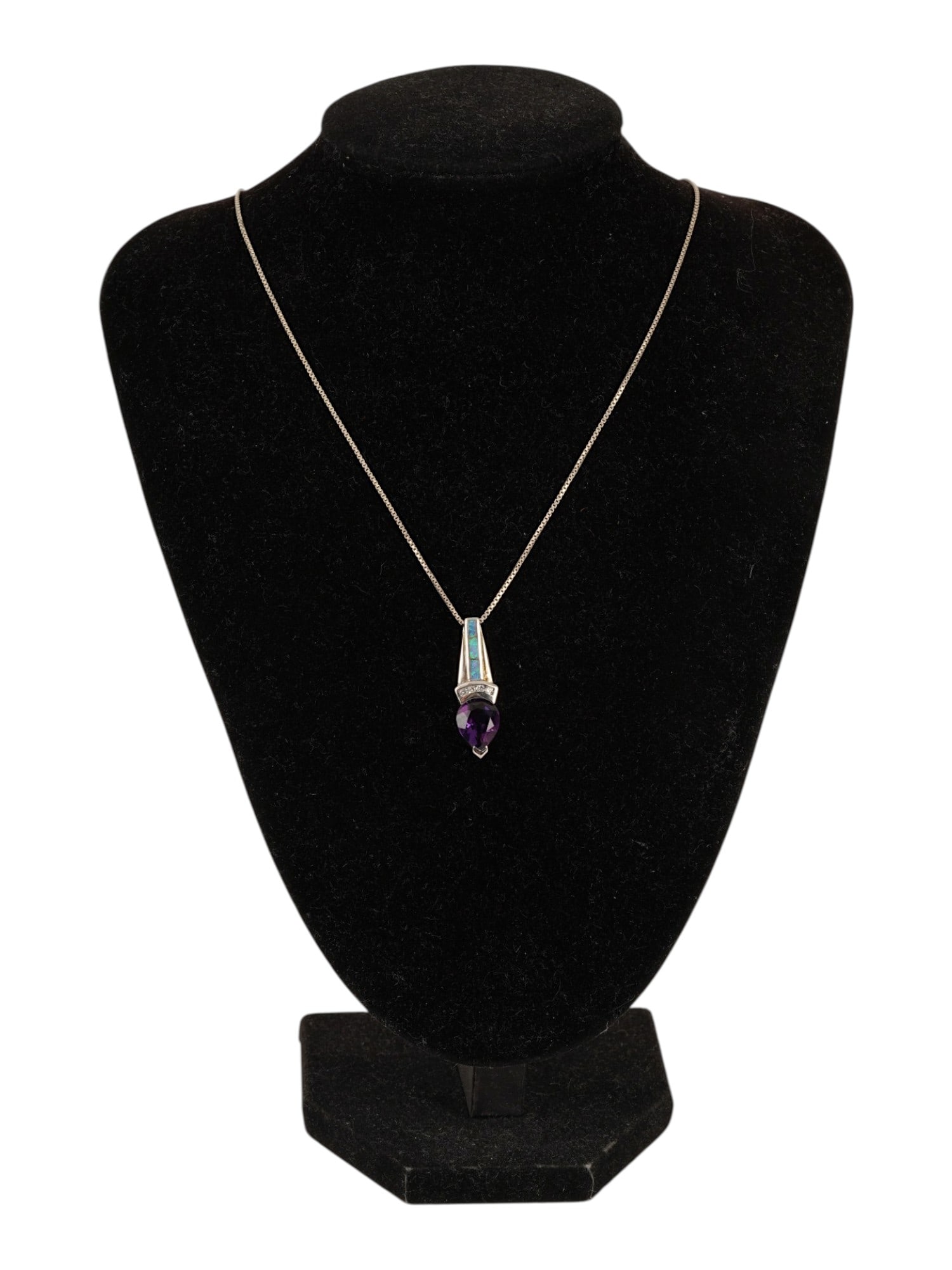 STERLING SILVER AMETHYST FIRE OPAL PENDANT NECKLACE: An Italian Sterling Silver necklace featuring a sterling silver pendant centered with a heart shaped faceted amethyst of a deep violet hue. The pendants bail is detailed with a rectangular inlay of fi