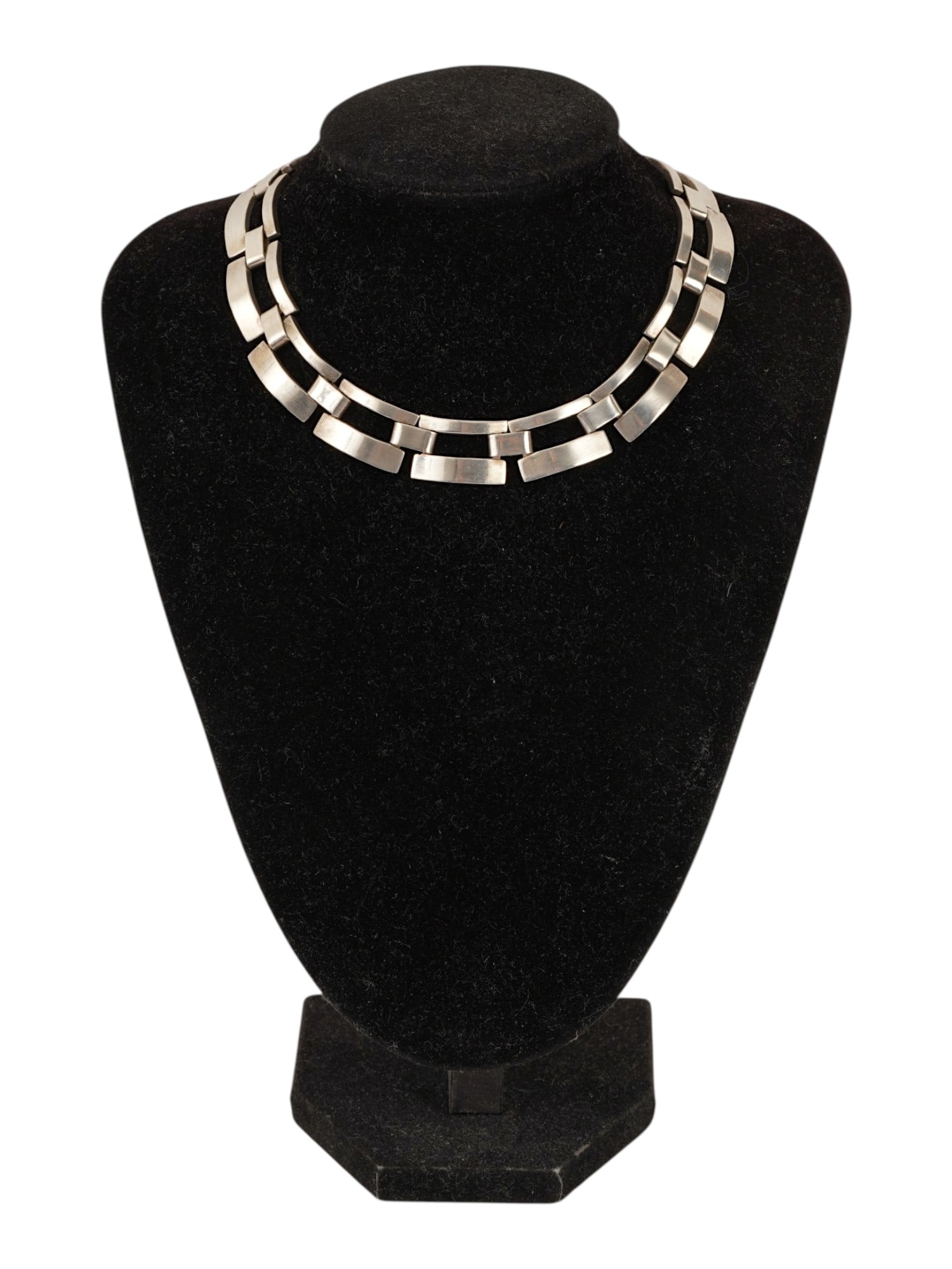 MODERNIST MEXICAN STERLING SILVER LINK NECKLACE: A Modernist Mexican necklace crafted in 925 sterling silver and features a series of geometric, open work rectangular links. The necklace is secured with an integrated box clasp and bears hallmarks in