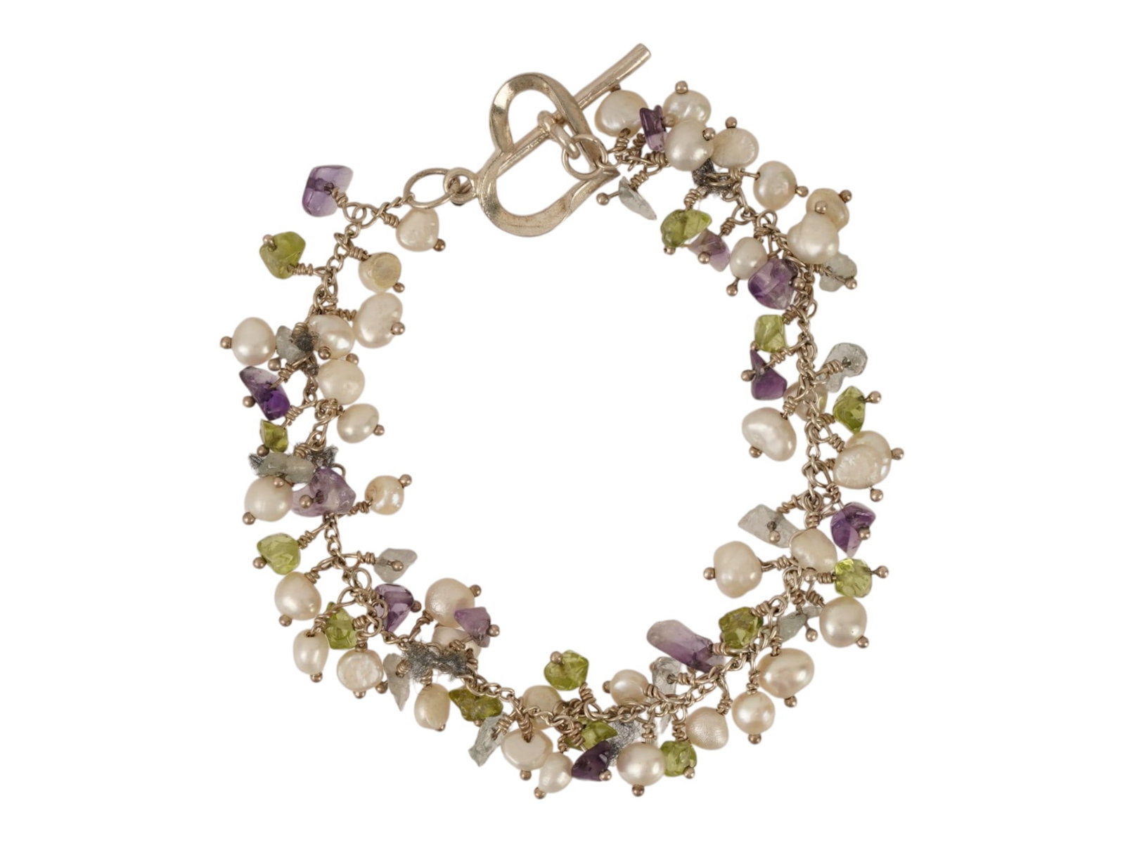 STERLING SILVER PEARLS MULTI COLOR GEMSTONES BRACELET: A sterling silver cluster bracelet composed of numerous faceted gemstone briolettes and cultured freshwater pearls suspended from a central link chain. The piece is finished with a stylized heart shap