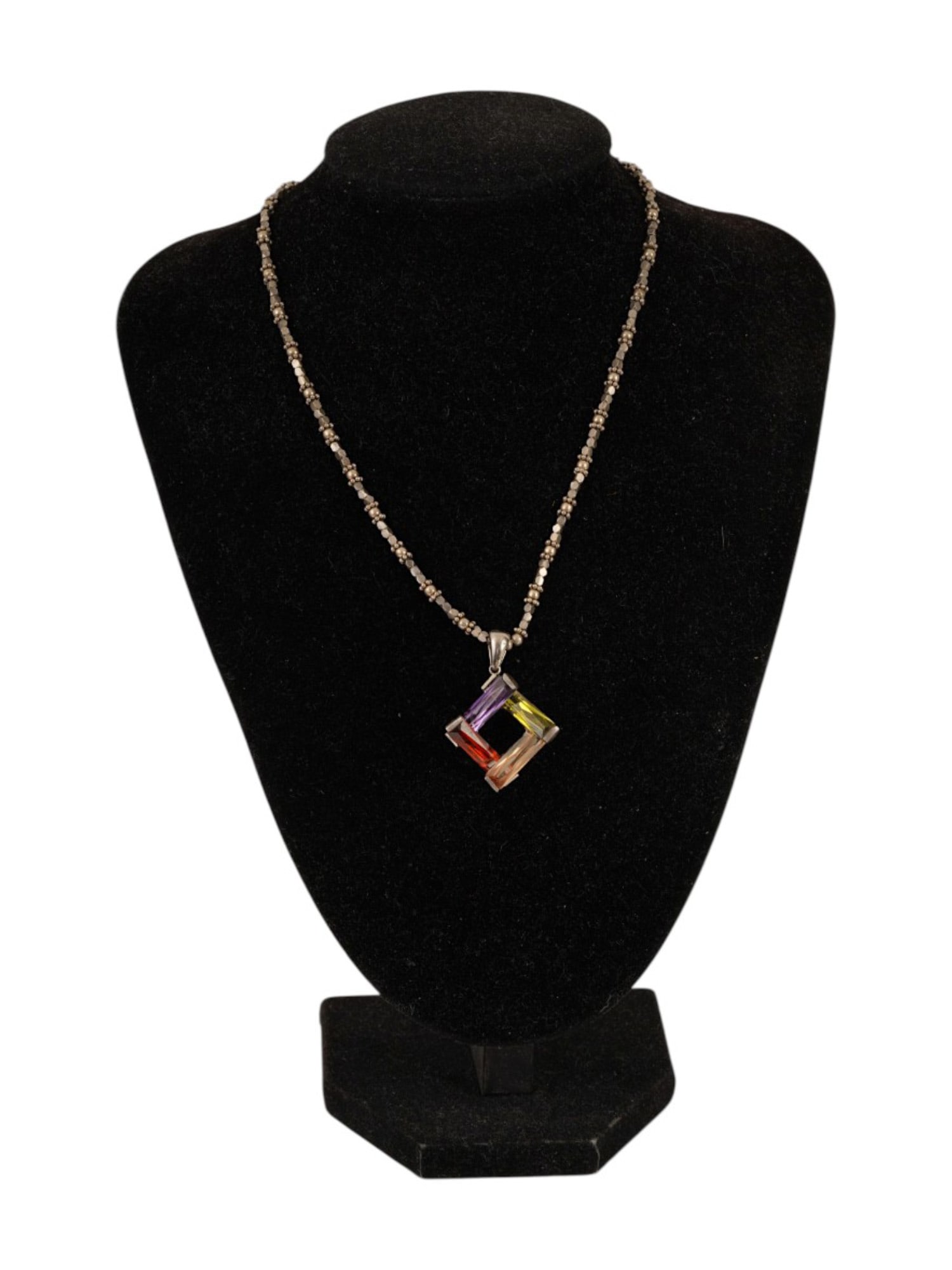 925 STERLING SILVER MULTI GEMSTONE PENDANT NECKLACE: A necklace featuring crafted in 925 sterling silver. The necklace is adorned with a geometric openwork pendant set with four rectangular cut gemstones in varying hues of purple, yellow, and orange. Th