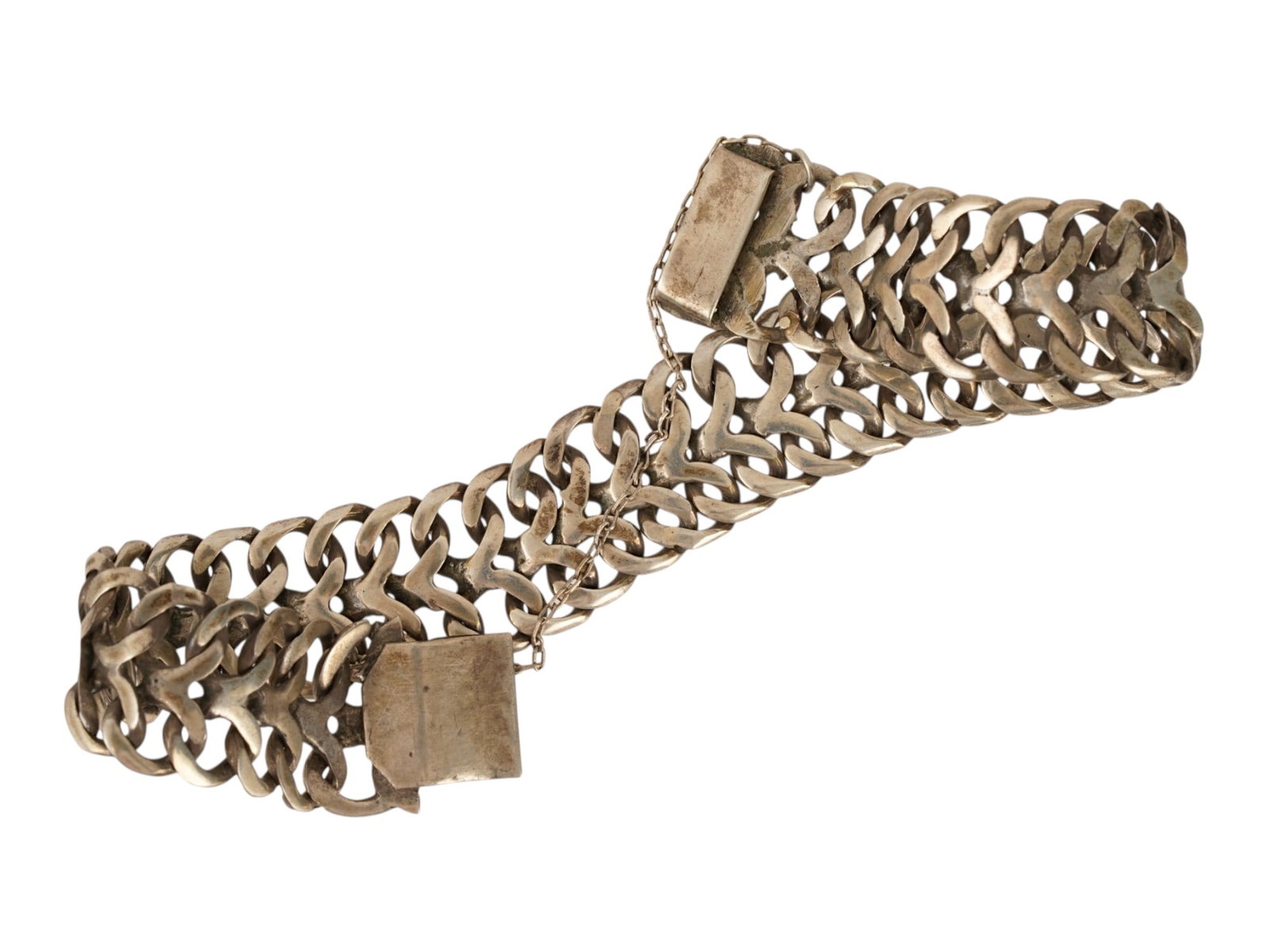 VINTAGE STERLING SILVER WIDE MULTI ROW GATE BRACELET: A vintage sterling silver wide multi-row gate bracelet with a chevron-link design. The flexible band is formed from four interlocking rows of curved V-shaped links and features a substantial box clasp
