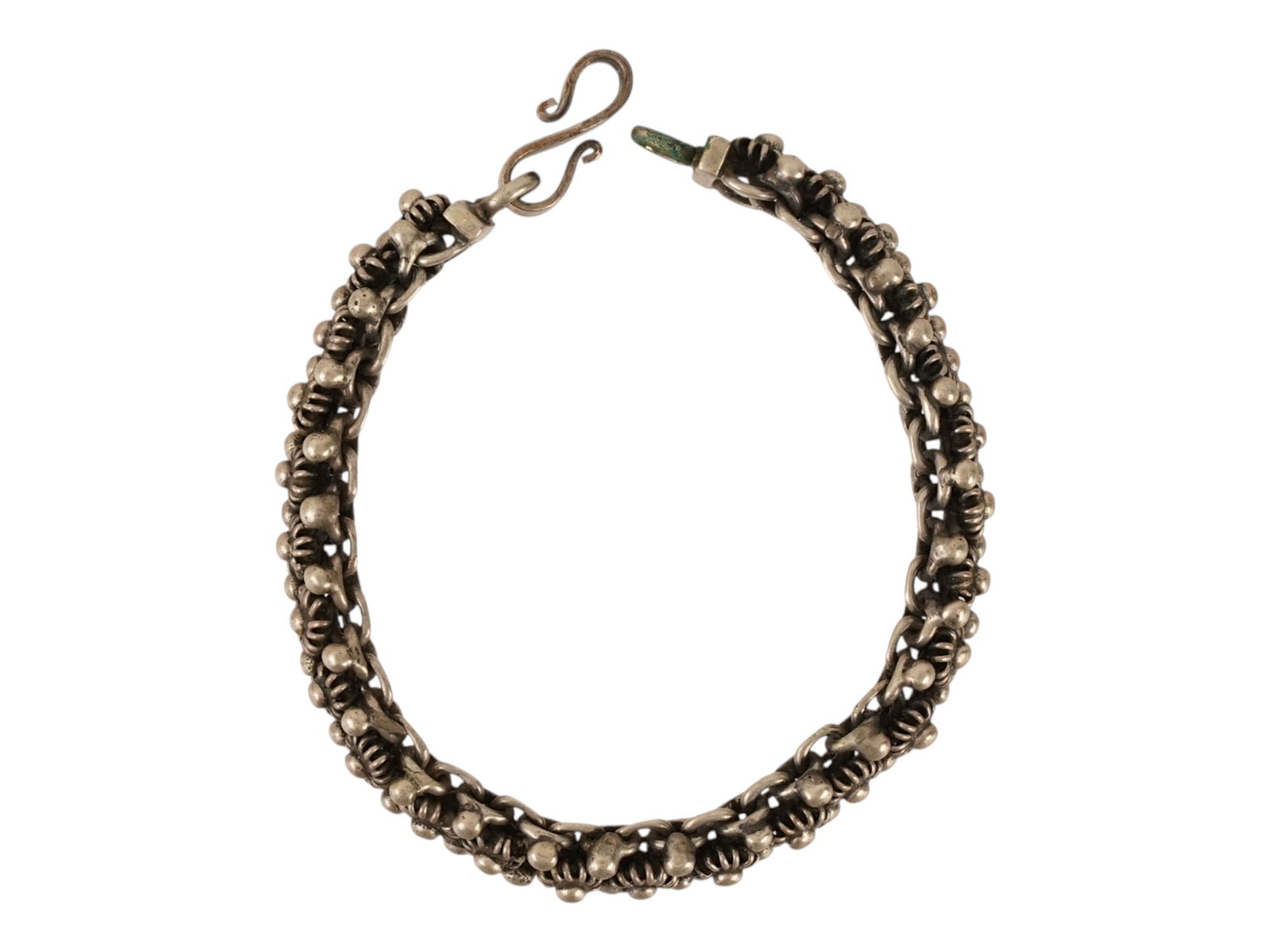 VINTAGE STERLING SILVER DENSE WOVEN LINK BRACELET: A vintage sterling silver link bracelet. The bracelet features a dense woven link design with textured silver granulation and a traditional S-hook clasp. Sterling Silver And Artisan Jewelry Collectibl