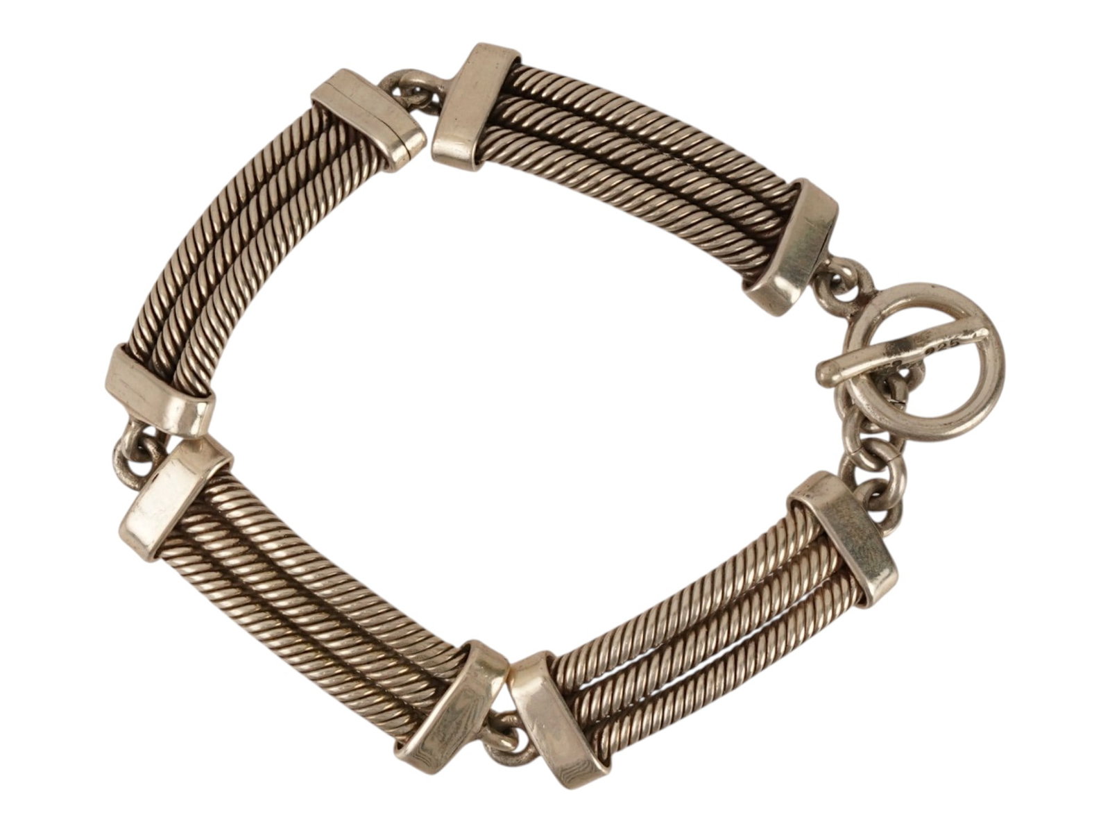 MEXICAN STERLING SILVER TRIPLE CABLE BRACELET: A sterling silver bracelet composed of four triple cable links. Toggle clasp, marked Mexico 925. Weight: 46.7 g. Vintage Jewelry And Fashion Accessories. THIS LOT IS ELIGIBLE FOR A 30-DAY UNCONDITIONA