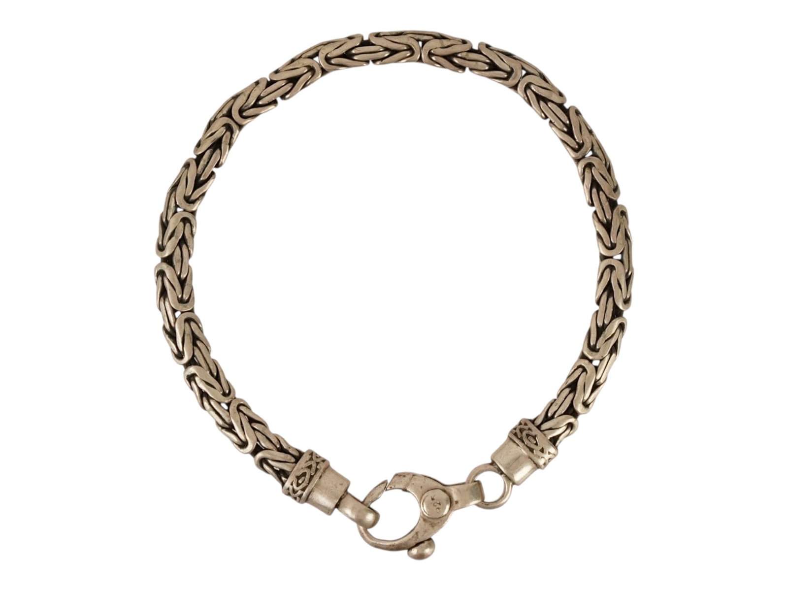 VINTAGE STERLING SILVER BYZANTINE CHAIN BRACELET: A sterling silver Byzantine chain bracelet. Marked 925 on the clasp. Weight: 26.3 g. Vintage Statement Jewelry And Fashion Accessories. THIS LOT IS ELIGIBLE FOR A 30-DAY UNCONDITIONAL RETURN FROM THE 