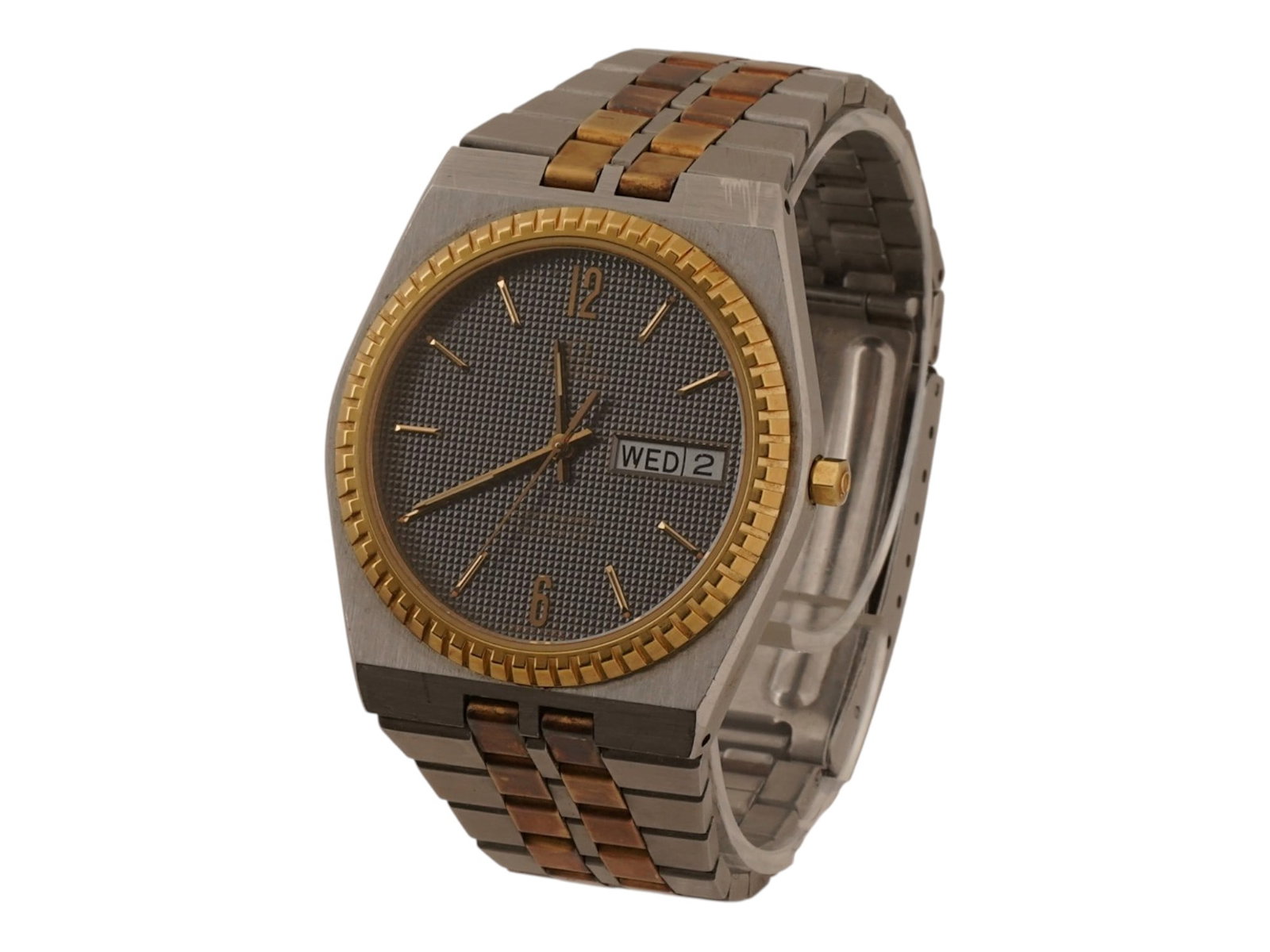 MENS OMEGA SEAMASTER GOLD QUARTZ WRIST WATCH: A Mens Omega Seamaster Quartz wristwatch from the 1980s. A dark gray dial with an intricate raised waffle texture, gold tone markers and hands, and a double day date aperture at the 3 oclock position.