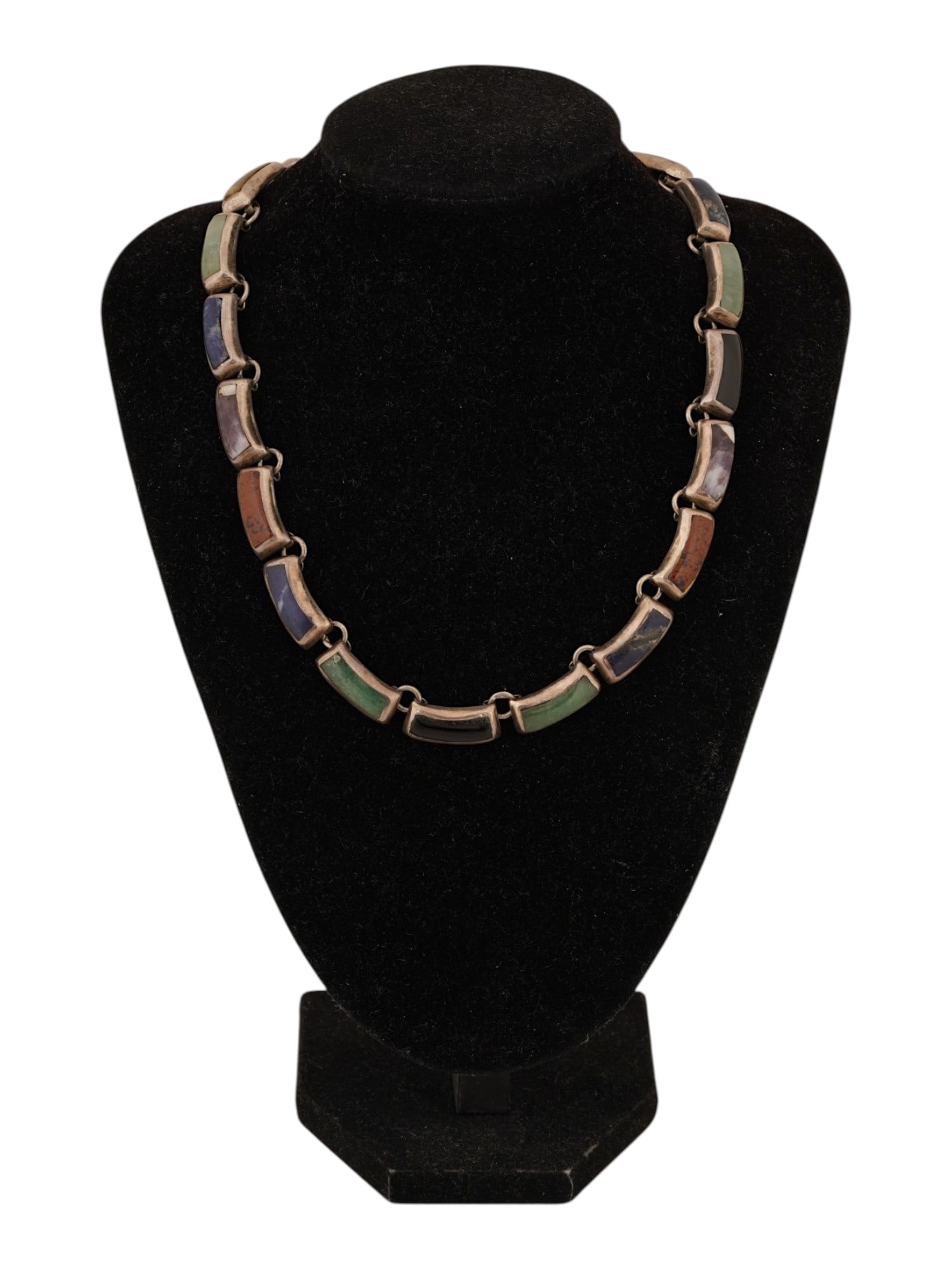 MEXICAN STERLING SILVER GEMSTONE LINK NECKLACE: A vintage silver necklace. Composed of rectangular links set with green, red, and blue mineral stones. Marked 925 Hecho en Mexico TA-137 on the backside. Total Weight: 65 g. Vintage Jewelry And Fashio
